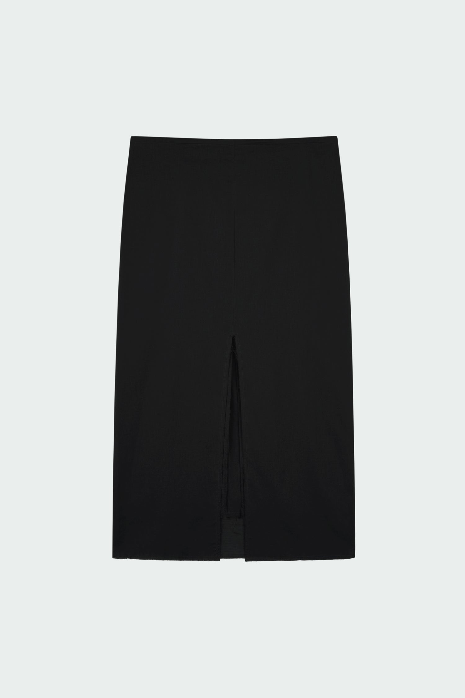 Amelia Skirt in black, a lightweight cotton midi skirt with inner drawstring waist, hidden side pockets, lined layers, raw-edge hem, and a center back slit for ease and movement