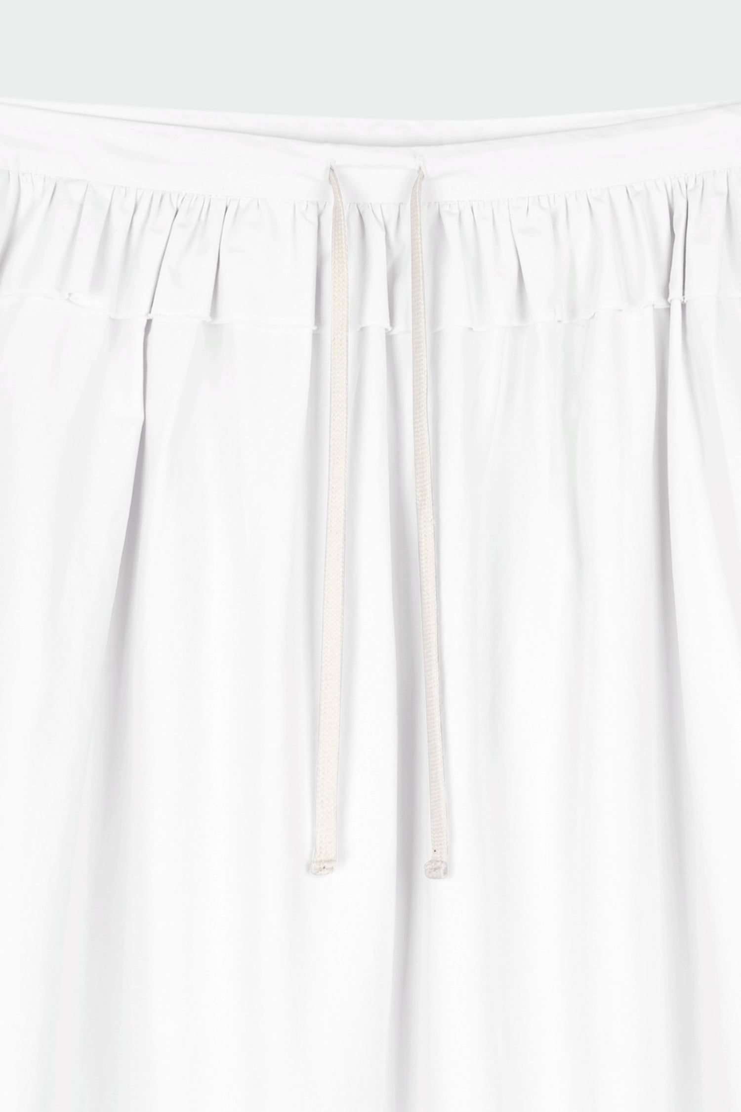 Maryam Skirt in sky, a midi cotton skirt with shirred waistband, drawstring detail, side pockets, and a softly flared silhouette