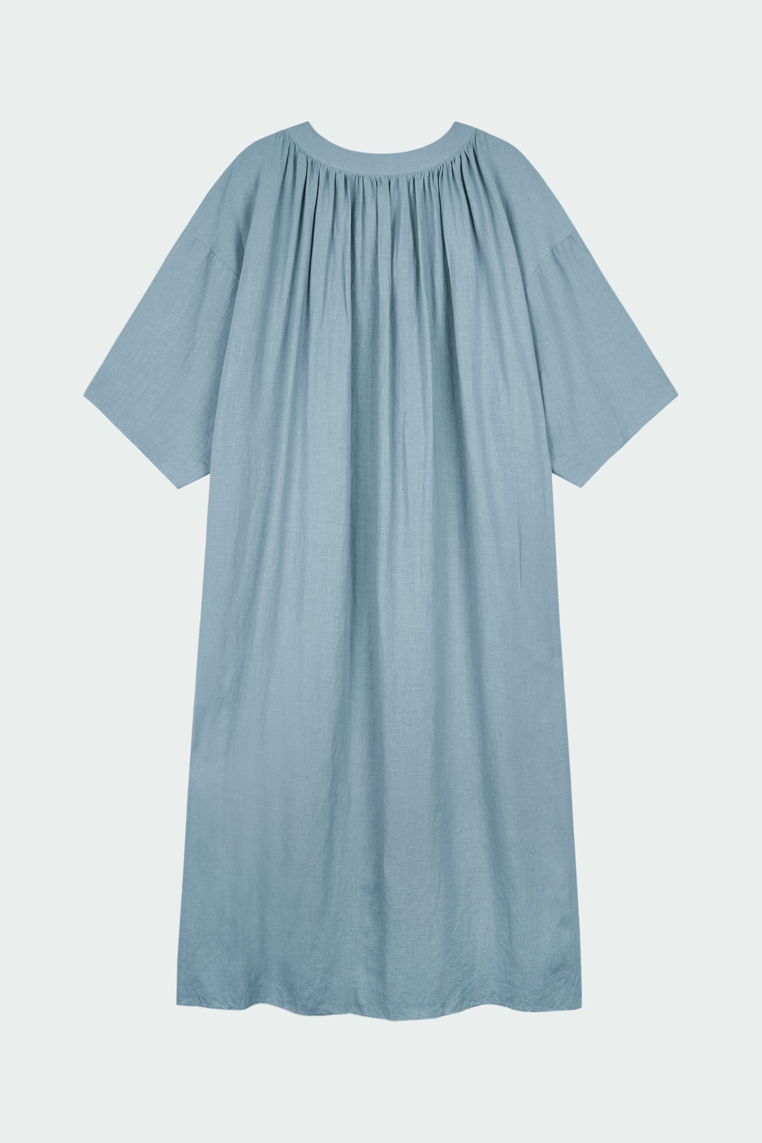 Charlotte Dress in light blue, V-neck summer maxi dress in a lightweight linen-rayon blend with drop shoulders, hidden side pockets, raw edge hem, and a relaxed fit.