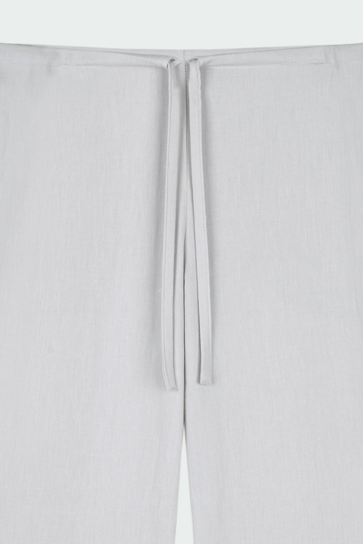 Chloe Pants in cloud gray, lightweight cotton pants with a drawstring waist, side pockets, and a flared bottom, relaxed fit for effortless everyday wear