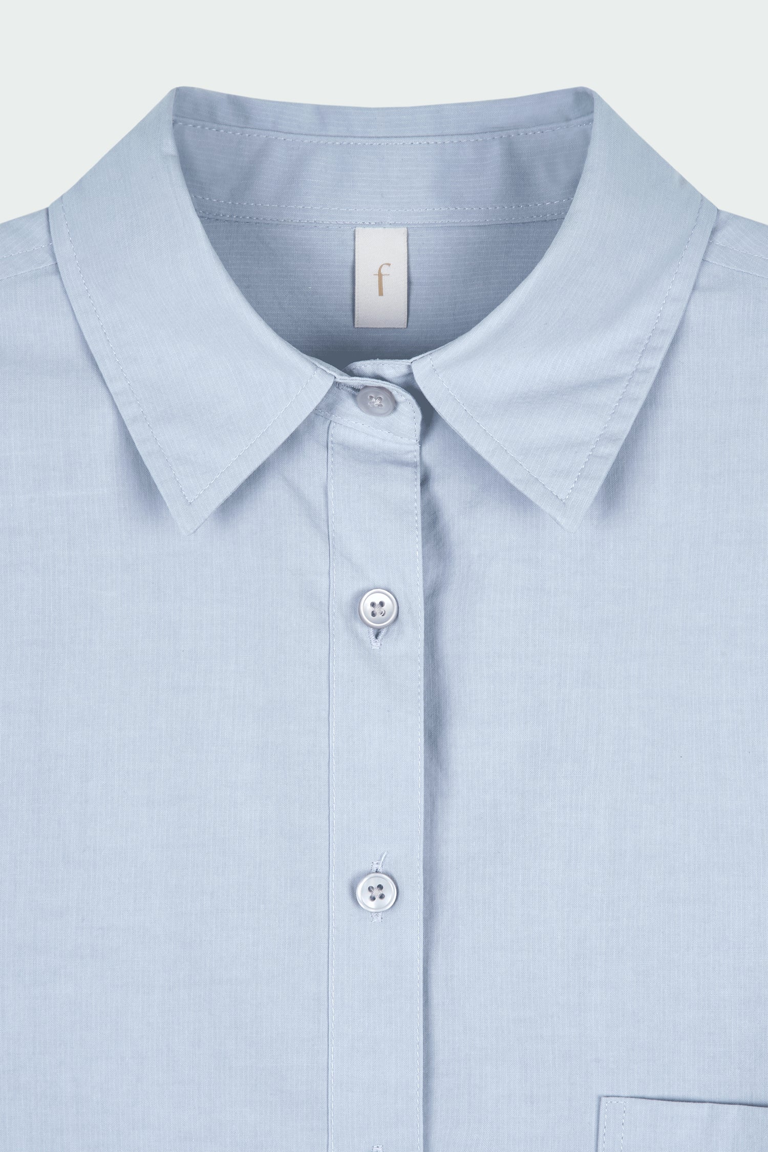 Isabella Shirt in sky, a lightweight cotton-poly blend button-up with chest pocket, back pleat, and buttoned cuffs, designed in a regular fit with a hip-length silhouette