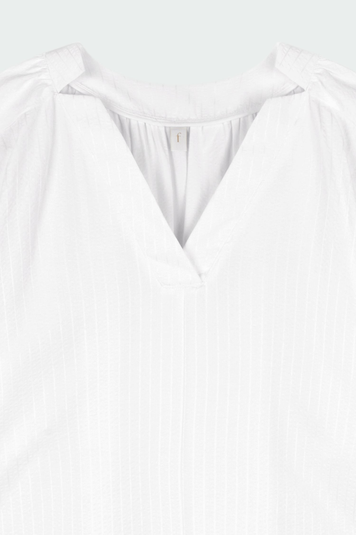 Charlotte Dress in white stripe, V-neck summer maxi dress in a lightweight linen-rayon blend with drop shoulders, hidden side pockets, raw edge hem, and a relaxed fit.