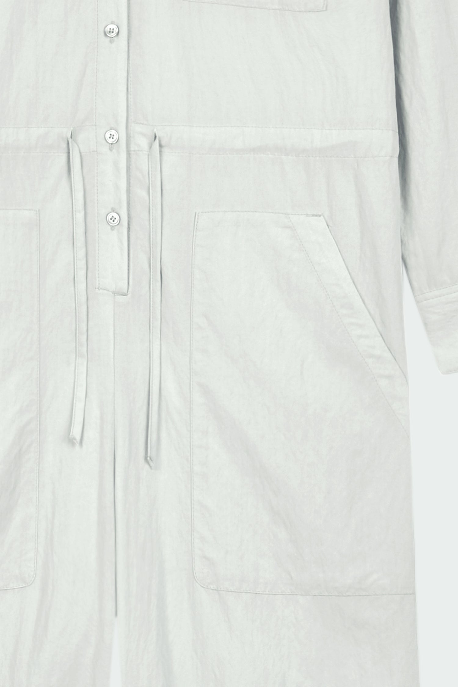 Saige Jumpsuit in cloud, long-sleeve rayon blend jumpsuit with point collar, front button closure, drawstring waist, and patch pockets.