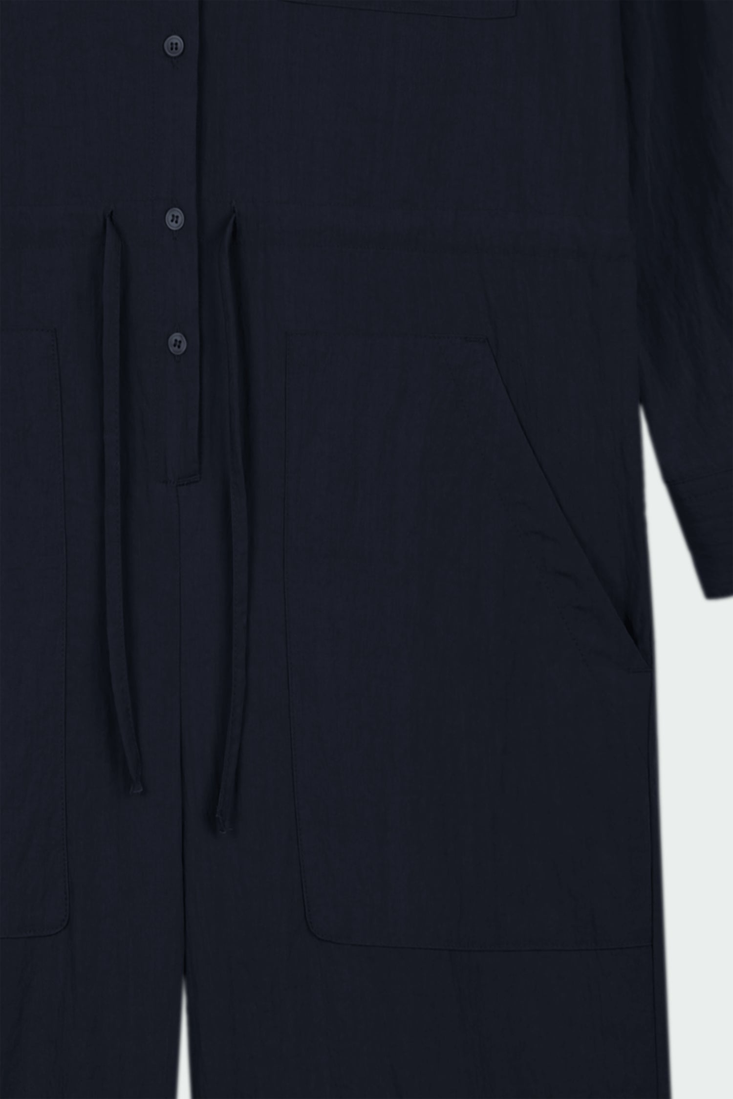 Saige Jumpsuit in navy, long-sleeve rayon blend jumpsuit with point collar, front button closure, drawstring waist, and patch pockets
