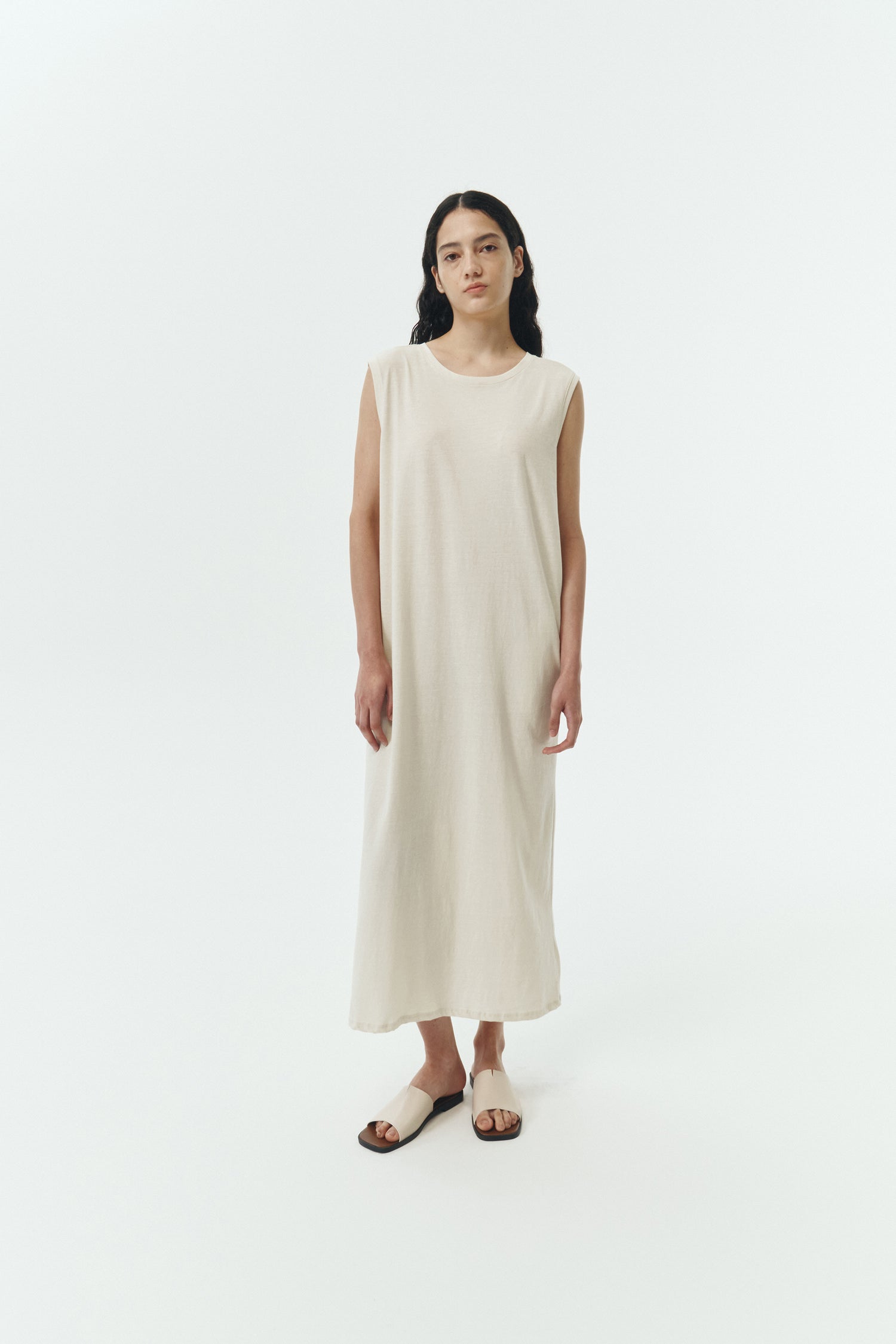 Jade Dress in cream, a sleeveless knit cotton midi dress with side pockets, designed for breathable summer comfort