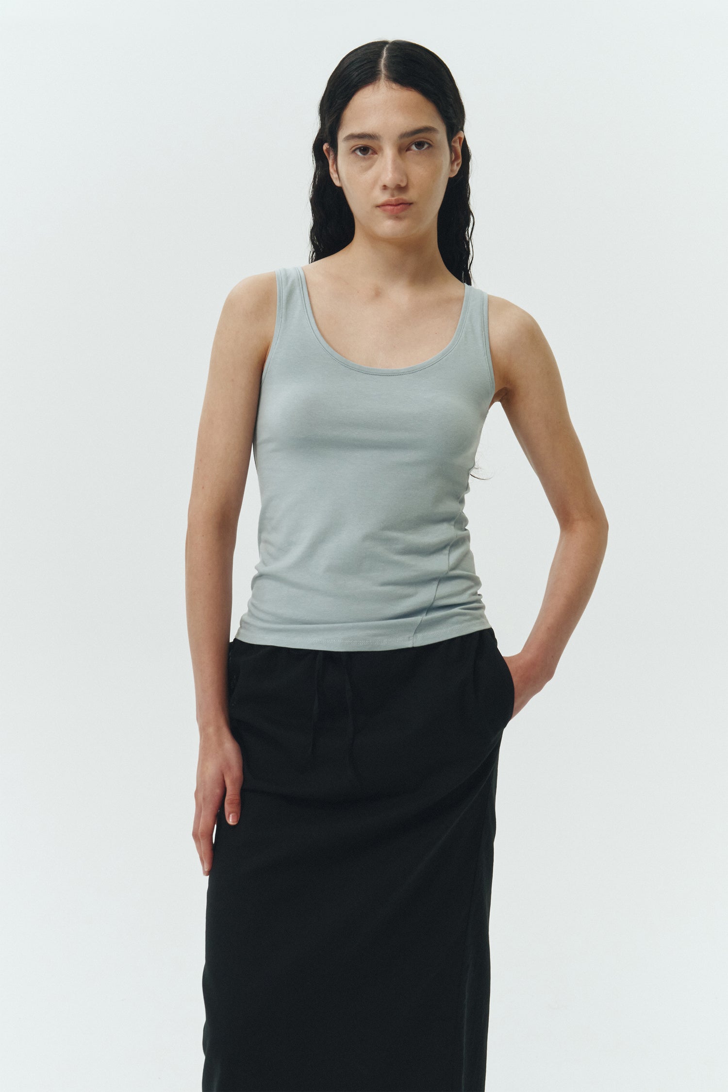 Zoe Tank Top in sky, slim-fit stretch cotton tank with scooped neckline and diagonal seam detail for a sleek and minimal silhouette.