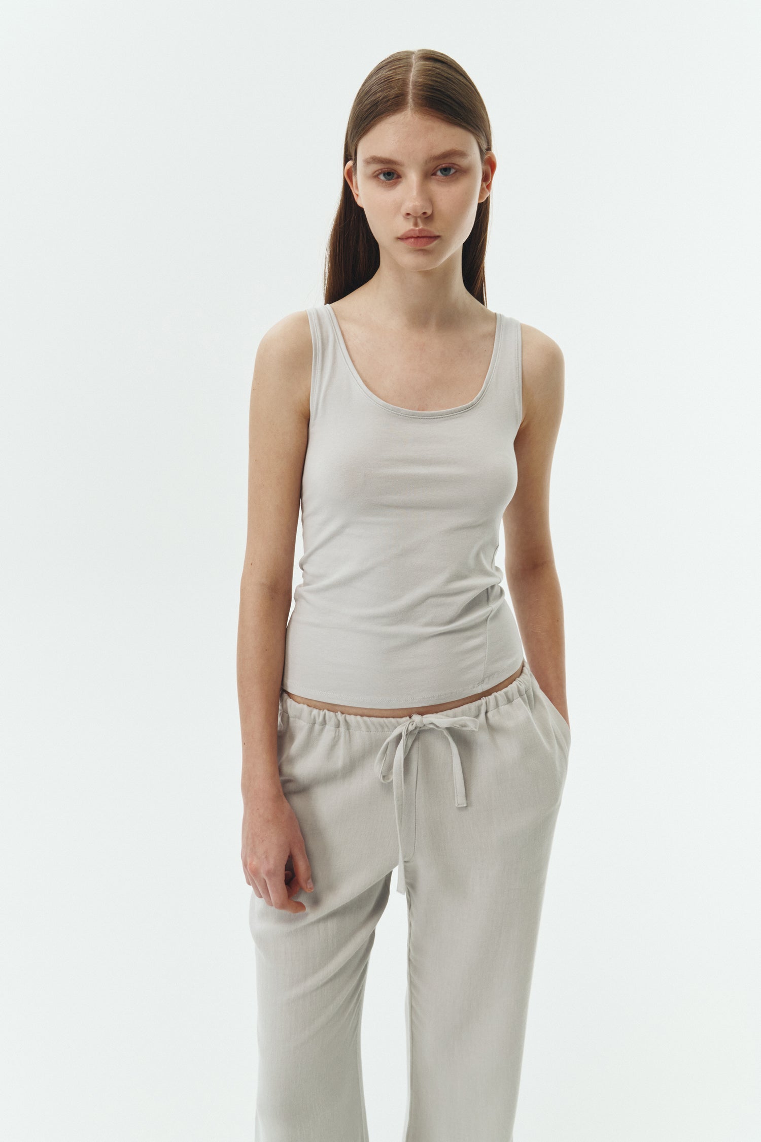 Chloe Pants in cloud gray, lightweight cotton pants with a drawstring waist, side pockets, and a flared bottom, relaxed fit for effortless everyday wear