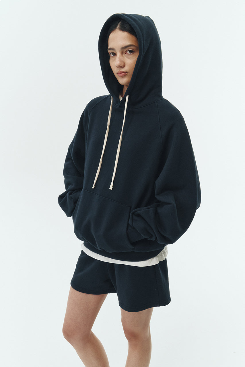Kaia Shorts in navy, mini-length cotton French terry shorts with an elasticated drawstring waist, side pockets, and back pocket, regular fit, part of a casual set