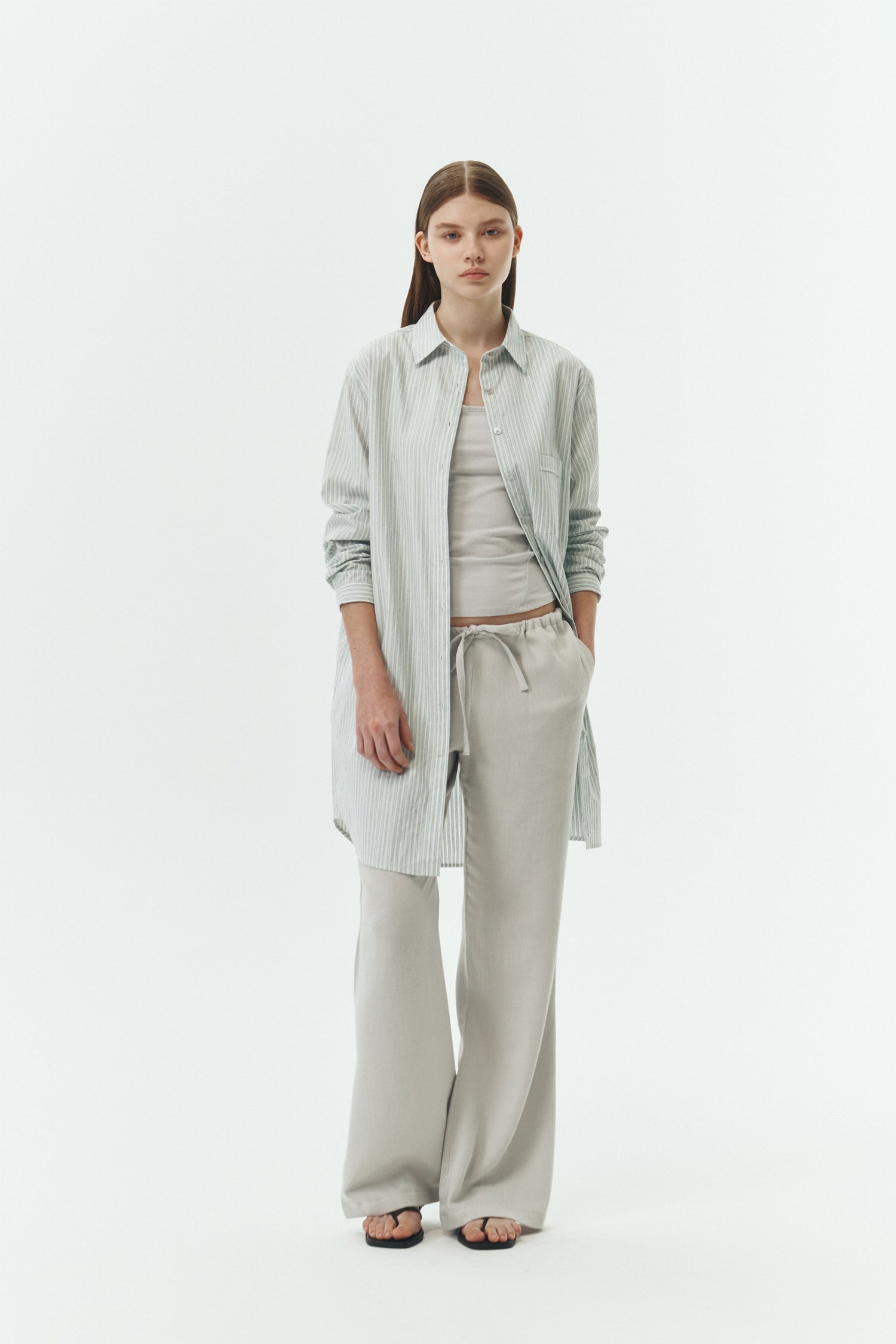 Cara Dress in stripe, long sleeve cotton shirt dress with front chest pocket, curved hem, hidden side pockets, and a relaxed silhouette.