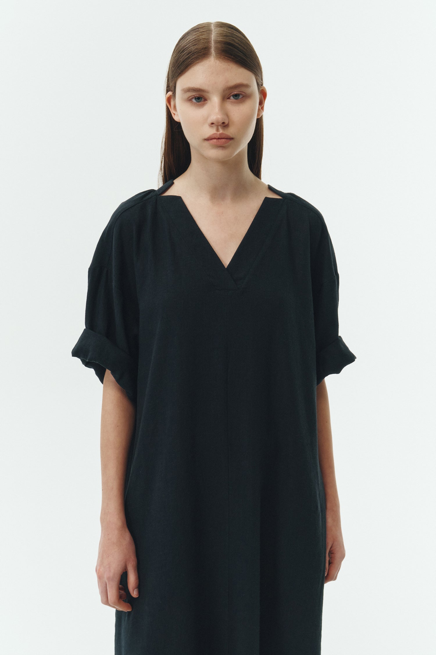 Charlotte Dress in navy, V-neck summer maxi dress in a lightweight linen-rayon blend with drop shoulders, hidden side pockets, raw edge hem, and a relaxed fit.