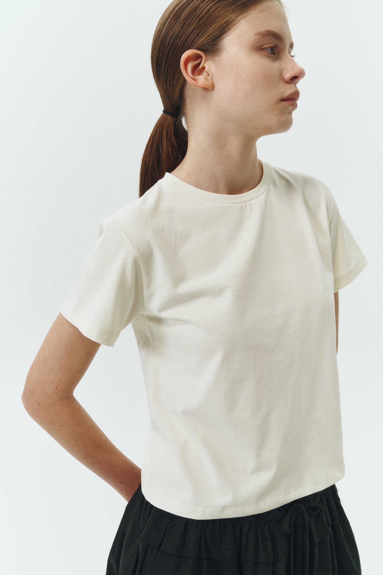 Ivy T-shirt in ivory, cropped short-sleeve tee in a lightweight cotton-poly blend with crew neck, regular fit, and clean silhouette.