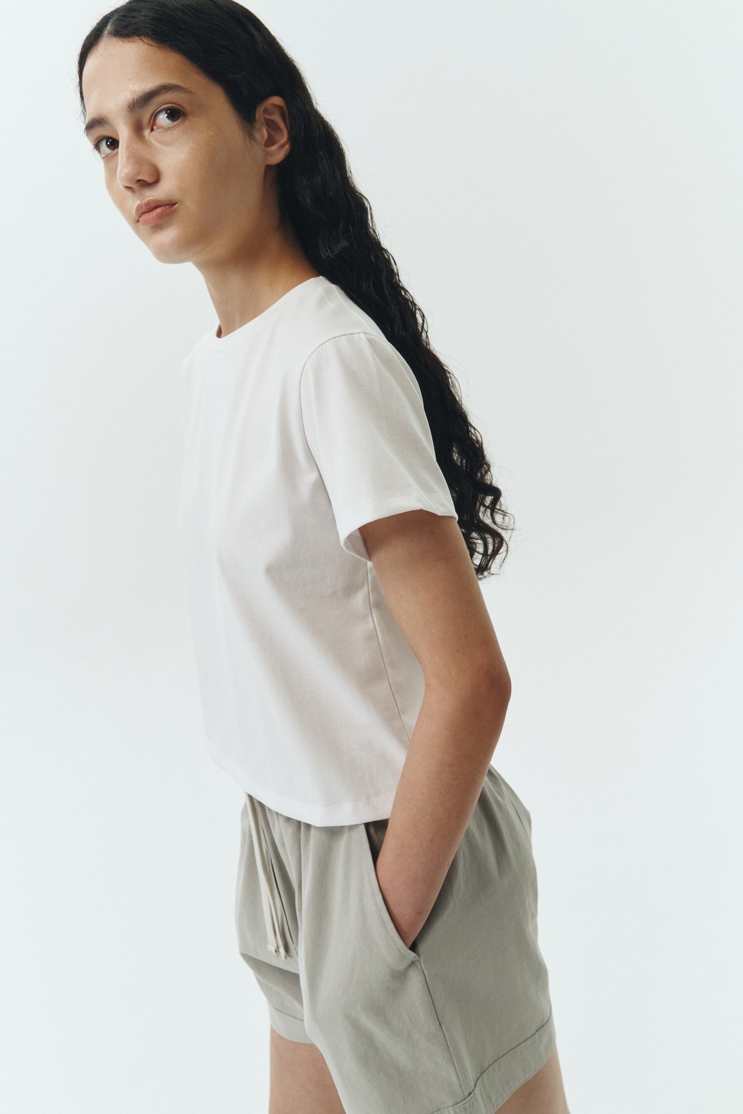 Ivy T-shirt in white, cropped short-sleeve tee in a lightweight cotton-poly blend with crew neck, regular fit, and clean silhouette.