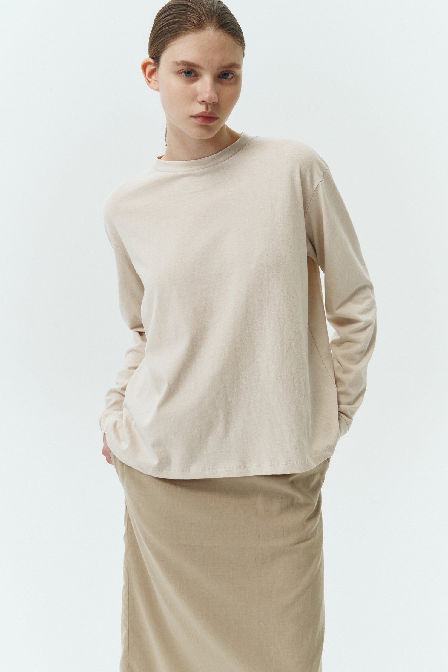 Lara Long-Sleeved T-Shirt in natural, a lightweight cotton crew-neck tee with long sleeves and relaxed fit, ideal for everyday wear and seasonal layering
