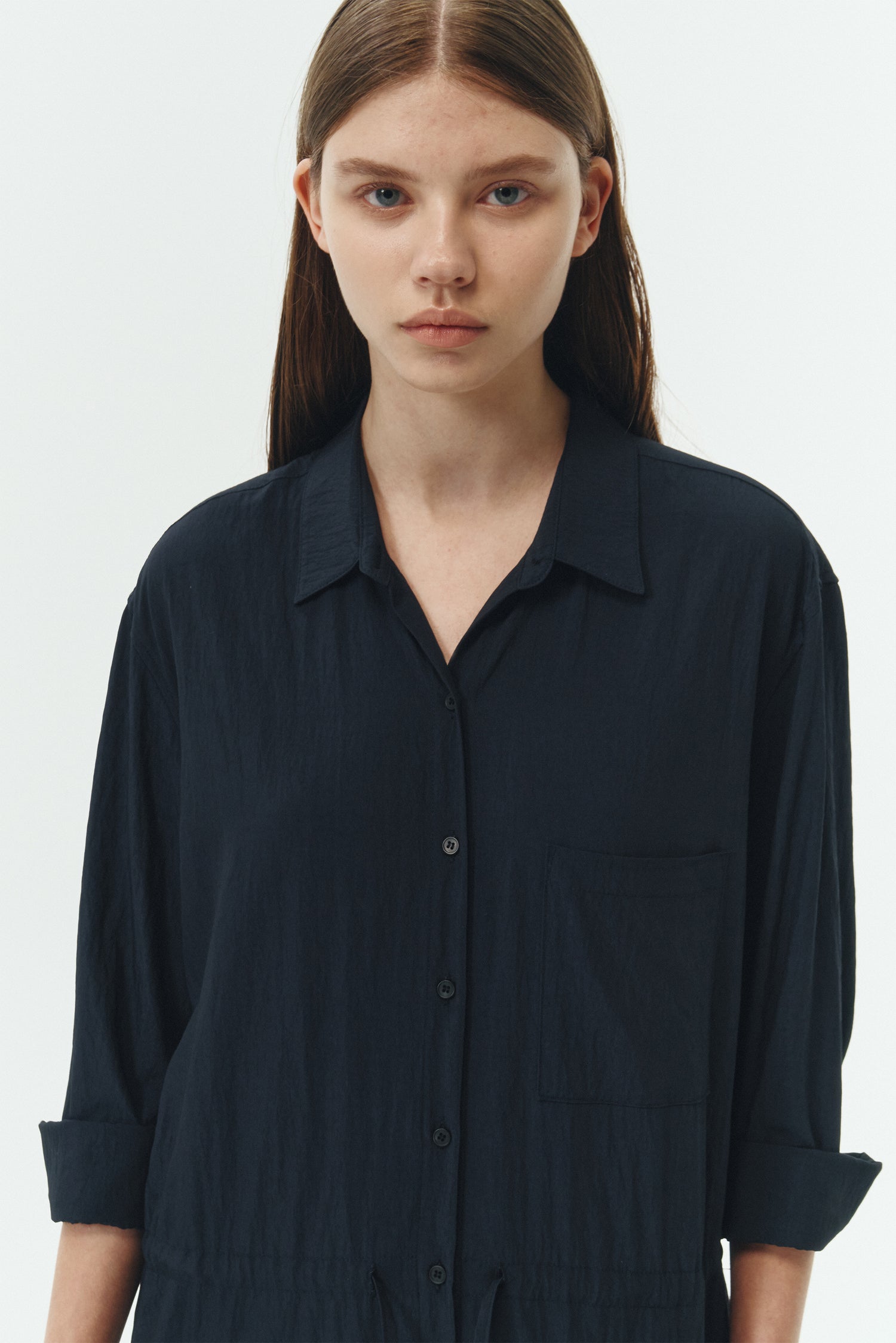 Saige Jumpsuit in navy, long-sleeve rayon blend jumpsuit with point collar, front button closure, drawstring waist, and patch pockets