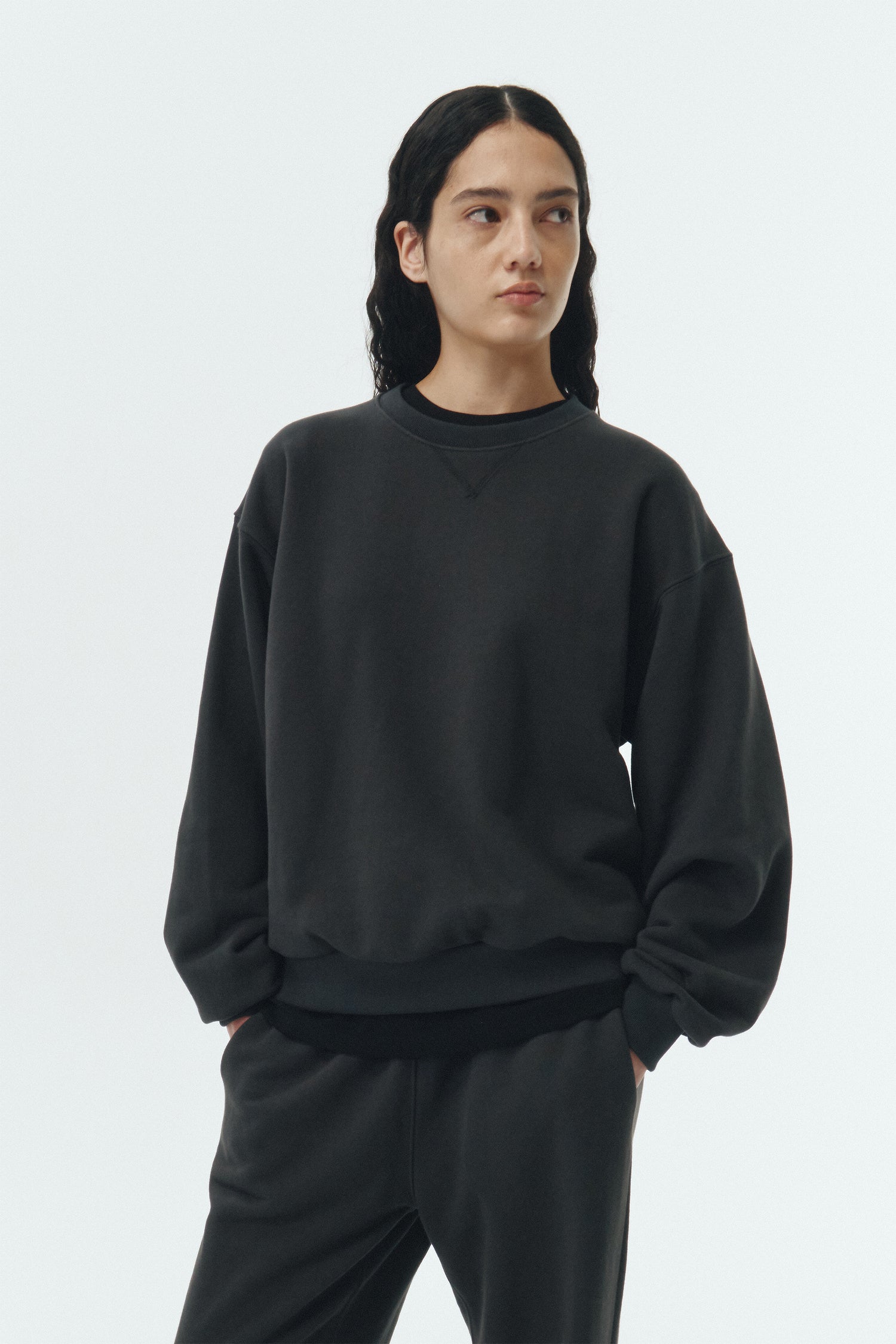 Willow Sweatshirt in ink black, a soft cotton French terry pullover with a crew neck, V-stitch detail, ribbed trims, and a relaxed fit, designed for everyday comfort