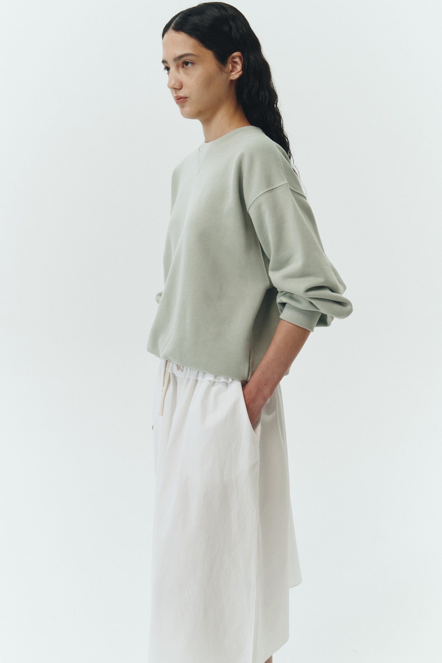 Maryam Skirt in sky, a midi cotton skirt with shirred waistband, drawstring detail, side pockets, and a softly flared silhouette