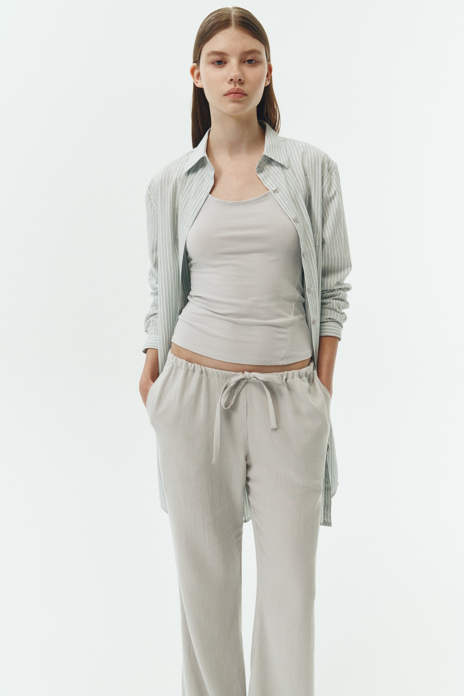 Cara Dress in stripe, long sleeve cotton shirt dress with front chest pocket, curved hem, hidden side pockets, and a relaxed silhouette.