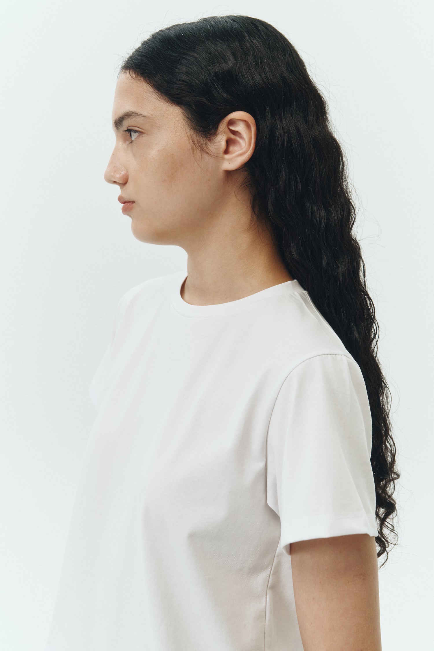 Ivy T-shirt in white, cropped short-sleeve tee in a lightweight cotton-poly blend with crew neck, regular fit, and clean silhouette.