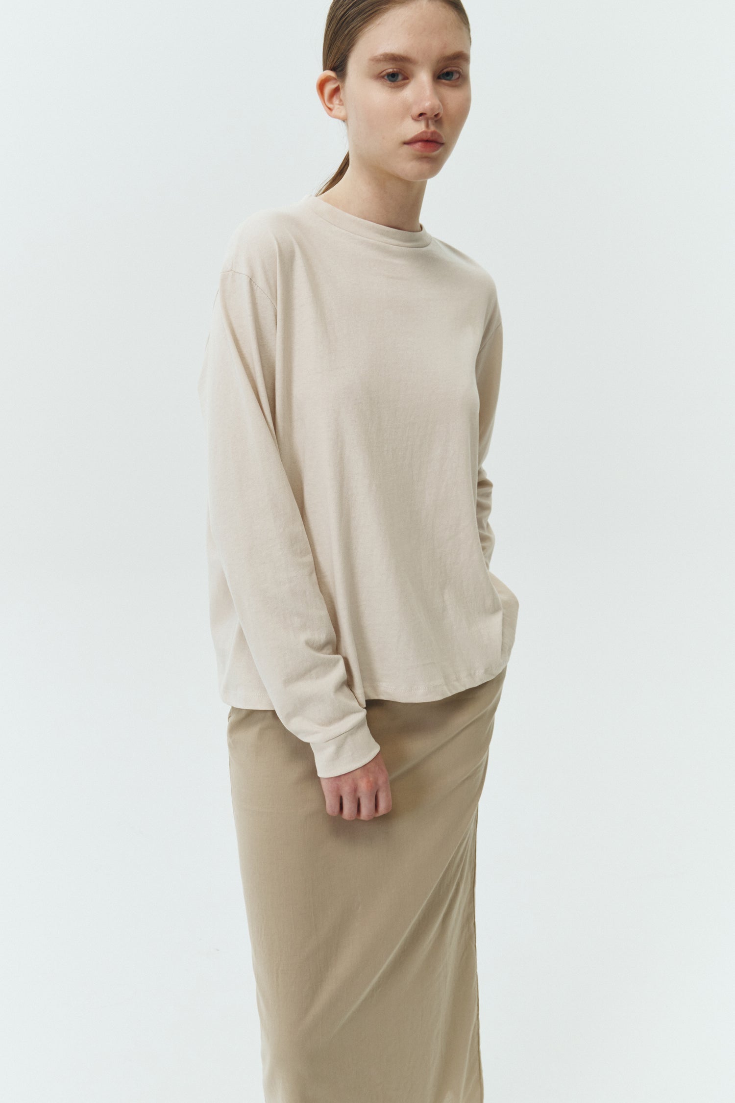 Lara Long-Sleeved T-Shirt in natural, a lightweight cotton crew-neck tee with long sleeves and relaxed fit, ideal for everyday wear and seasonal layering