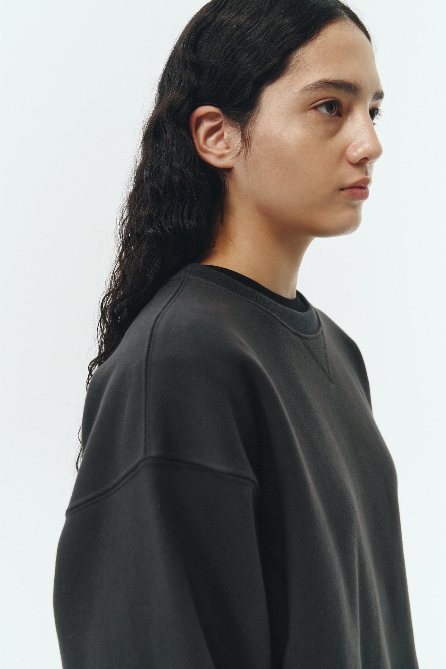 Willow Sweatshirt in ink black, a soft cotton French terry pullover with a crew neck, V-stitch detail, ribbed trims, and a relaxed fit, designed for everyday comfort