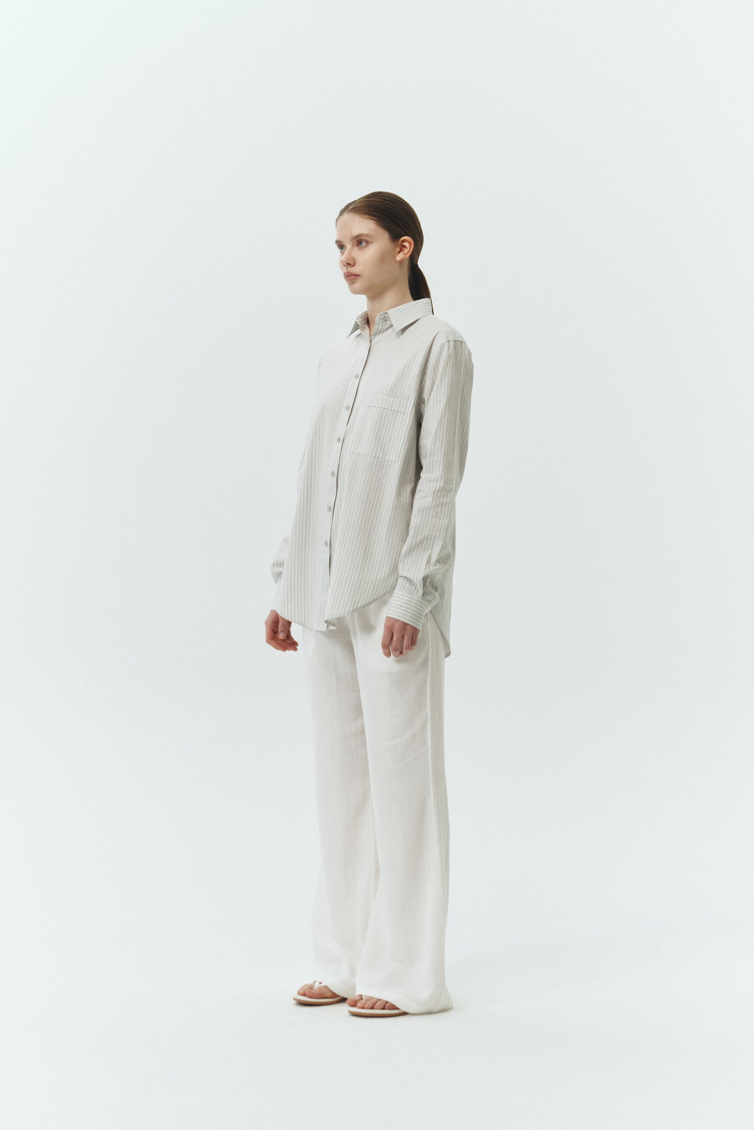 Chloe Pants in off white, lightweight cotton pants with a drawstring waist, side pockets, and a flared bottom, relaxed fit for effortless everyday wear