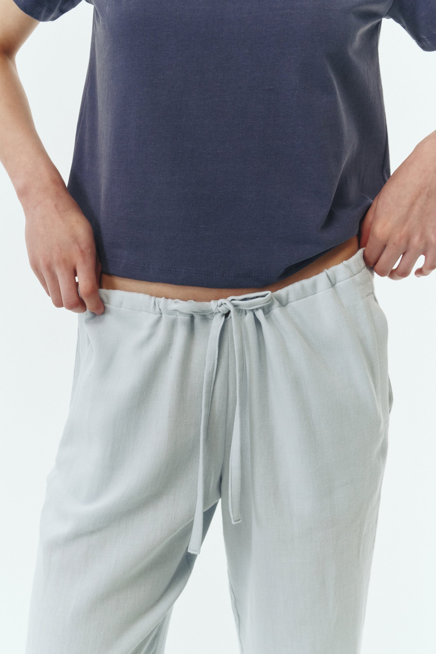 Chloe Pants in sky, lightweight cotton pants with a drawstring waist, side pockets, and a flared bottom, relaxed fit for effortless everyday wear