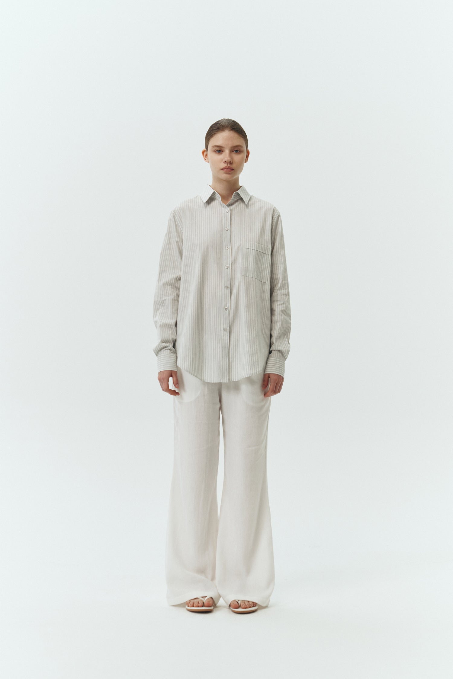 Isabella Shirt in stripe, a lightweight cotton-poly blend button-up with chest pocket, back pleat, and buttoned cuffs, designed in a regular fit with a hip-length silhouette