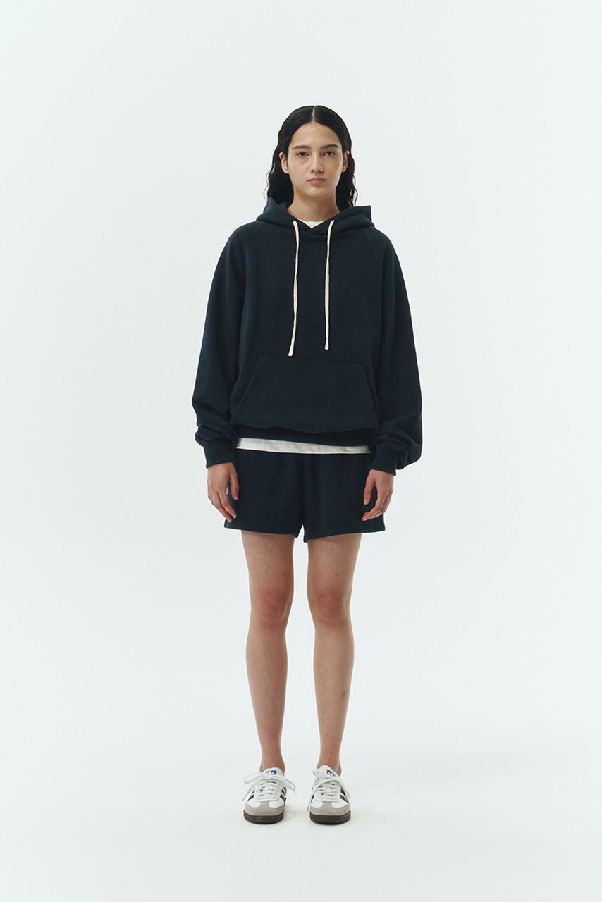 Kaia Shorts in navy, mini-length cotton French terry shorts with an elasticated drawstring waist, side pockets, and back pocket, regular fit, part of a casual set