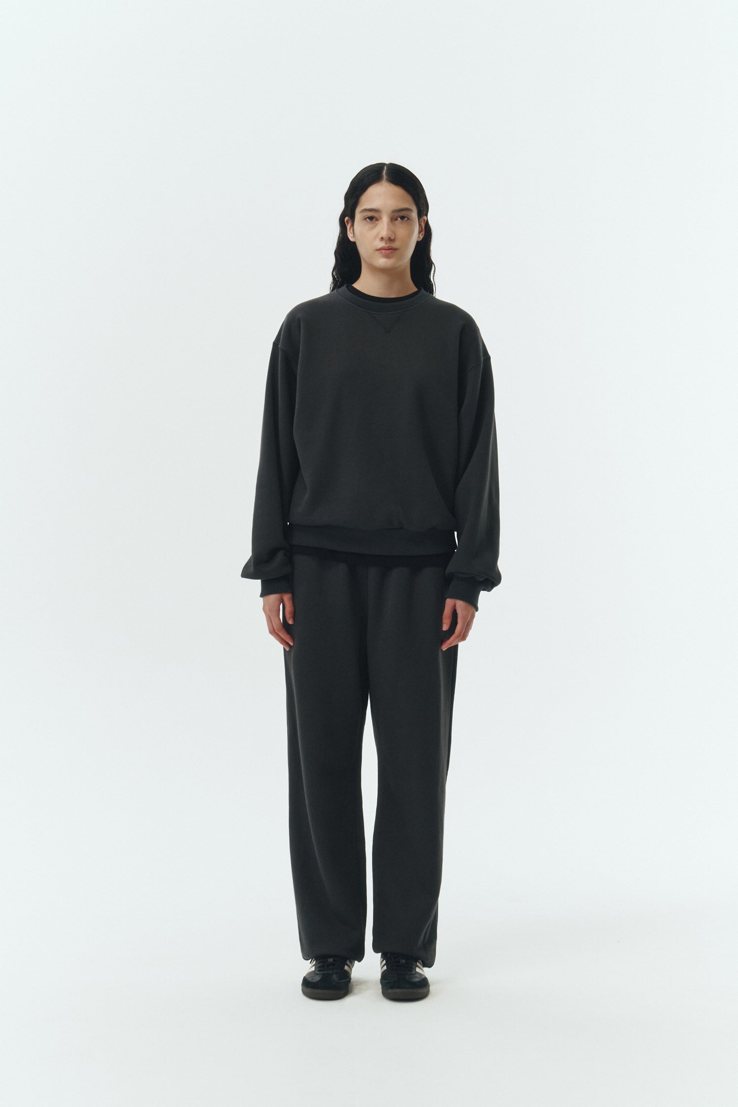 Willow Sweatpants in ink black, soft French terry cotton with drawstring waistband, side pockets, and elastic cuffs, regular fit, part of a set