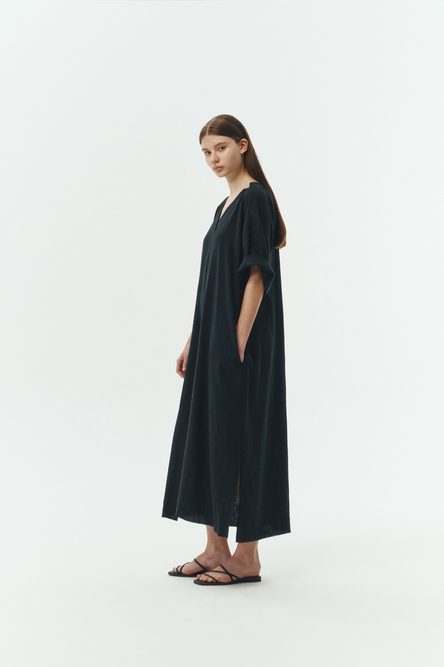 Charlotte Dress in navy, V-neck summer maxi dress in a lightweight linen-rayon blend with drop shoulders, hidden side pockets, raw edge hem, and a relaxed fit.