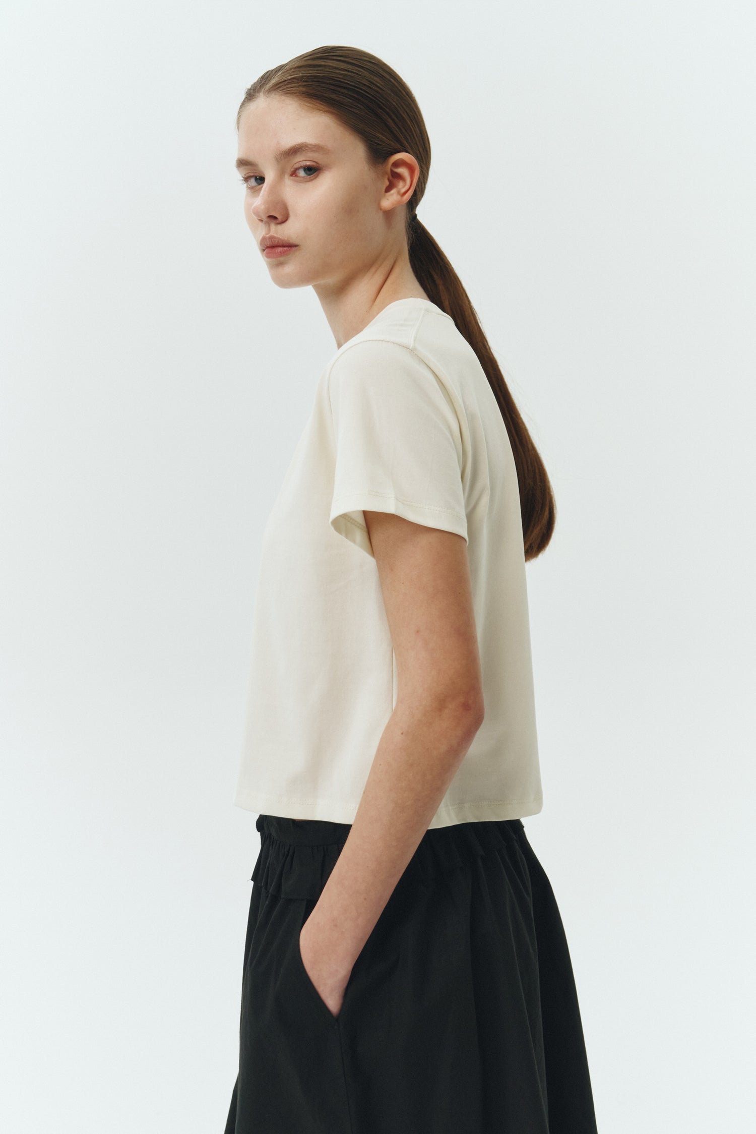 Ivy T-shirt in ivory, cropped short-sleeve tee in a lightweight cotton-poly blend with crew neck, regular fit, and clean silhouette.