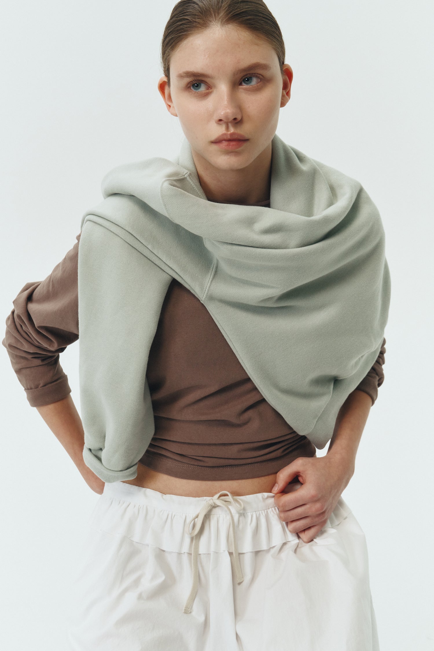 Lara Long-Sleeved T-Shirt in brown, a lightweight cotton crew-neck tee with long sleeves and relaxed fit, ideal for everyday wear and seasonal layering