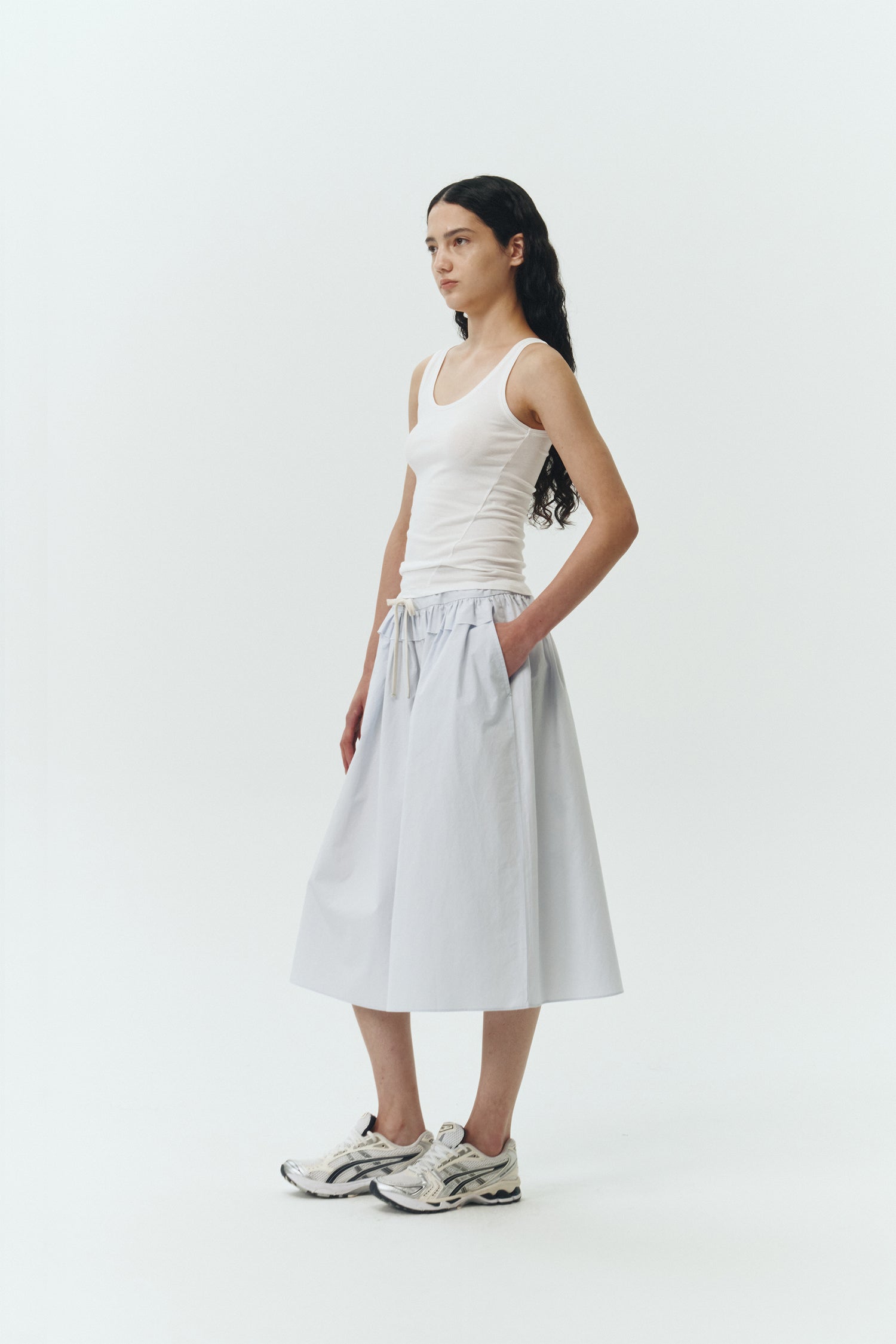 Zoe Tank Top in white, slim-fit stretch cotton tank with scooped neckline and diagonal seam detail for a sleek and minimal silhouette.
