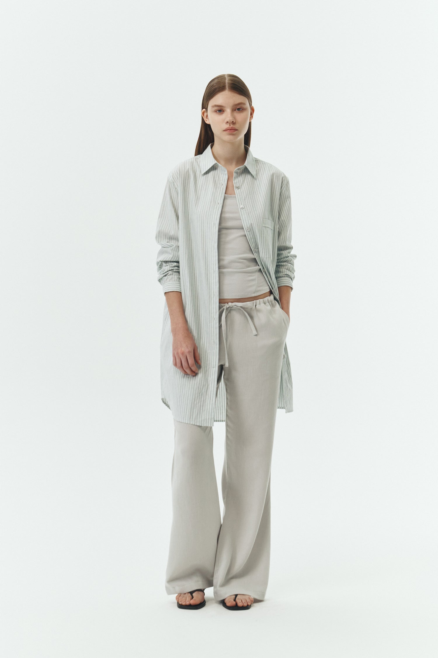 Chloe Pants in cloud gray, lightweight cotton pants with a drawstring waist, side pockets, and a flared bottom, relaxed fit for effortless everyday wear