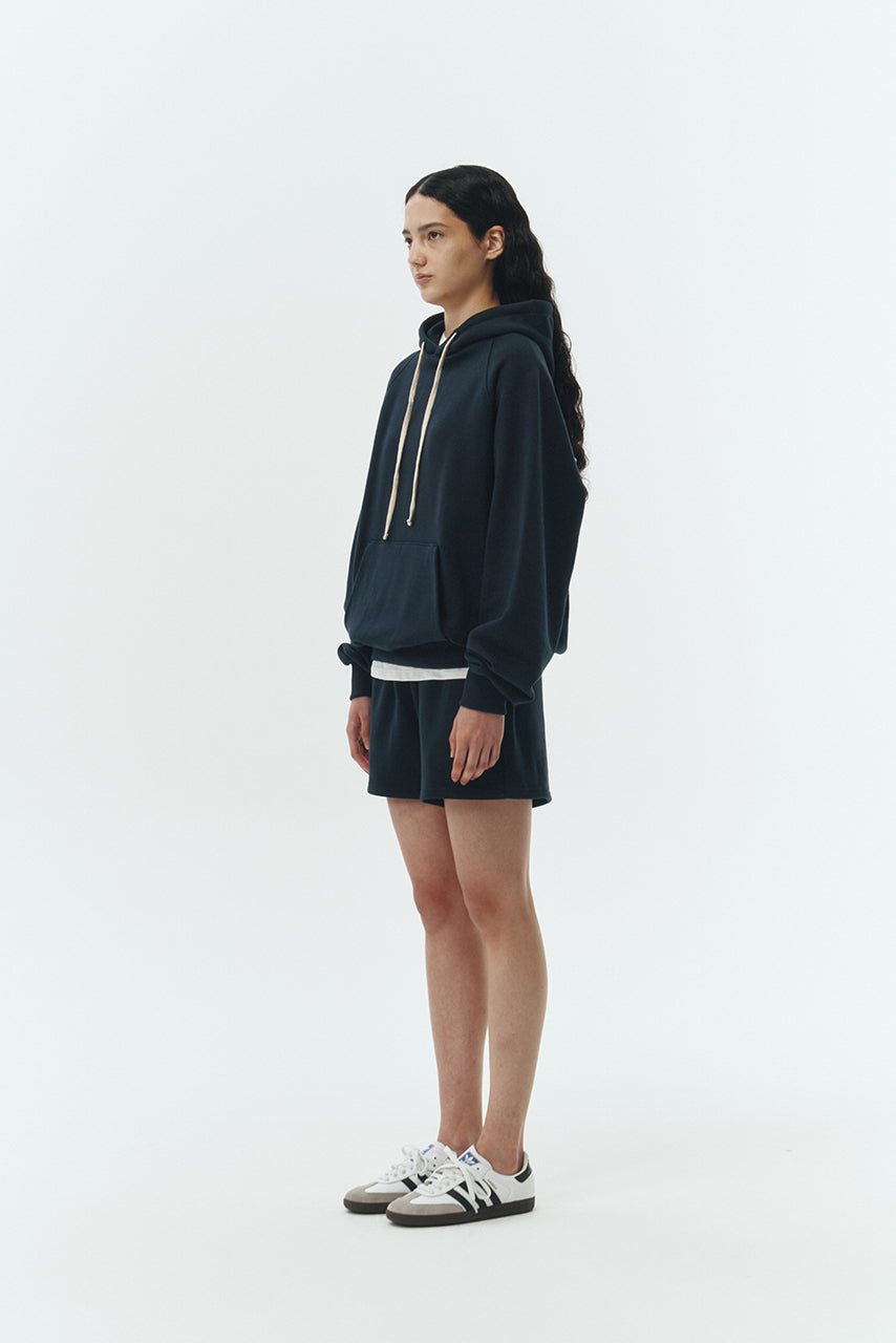 Kaia Shorts in navy, mini-length cotton French terry shorts with an elasticated drawstring waist, side pockets, and back pocket, regular fit, part of a casual set