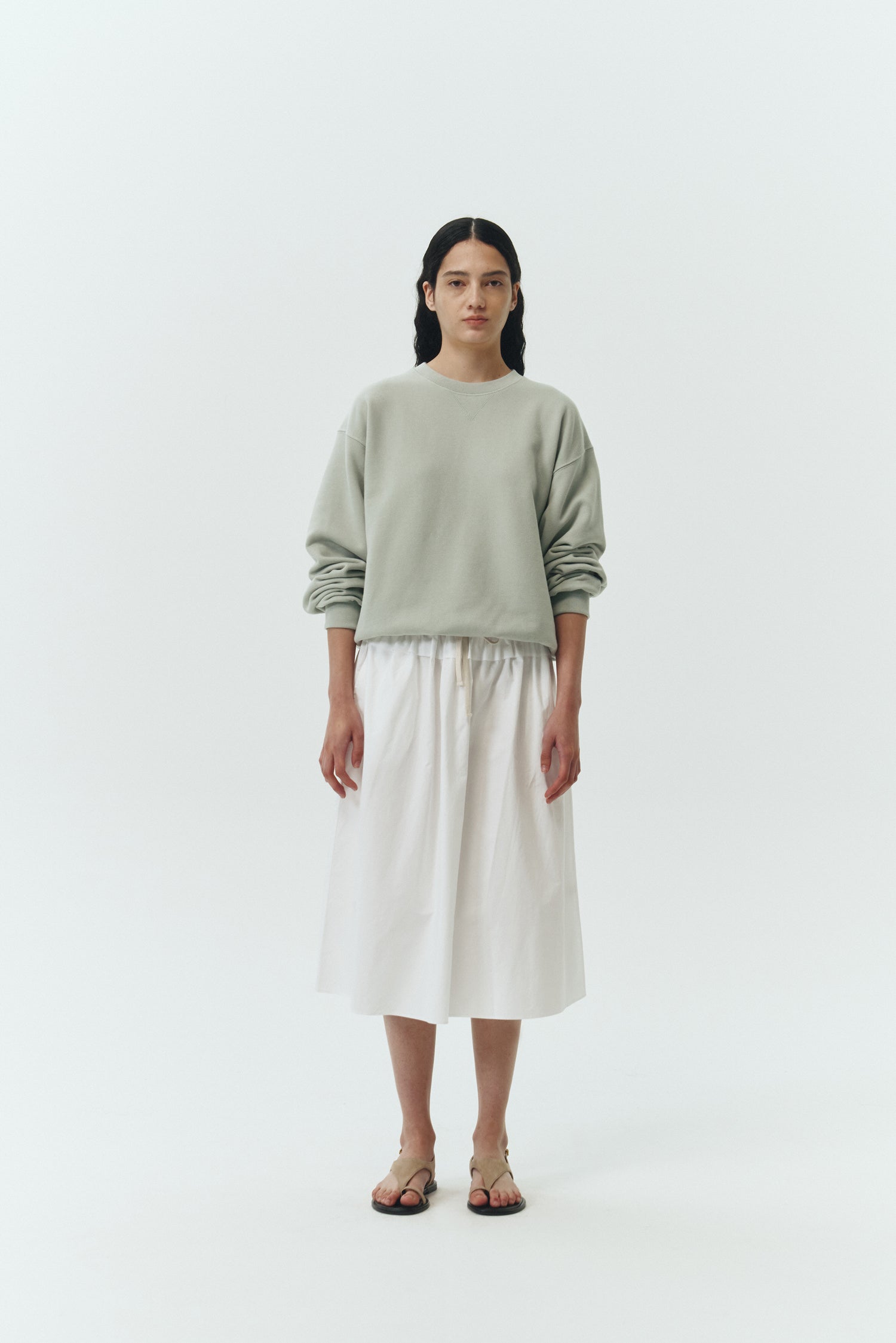 Maryam Skirt in sky, a midi cotton skirt with shirred waistband, drawstring detail, side pockets, and a softly flared silhouette