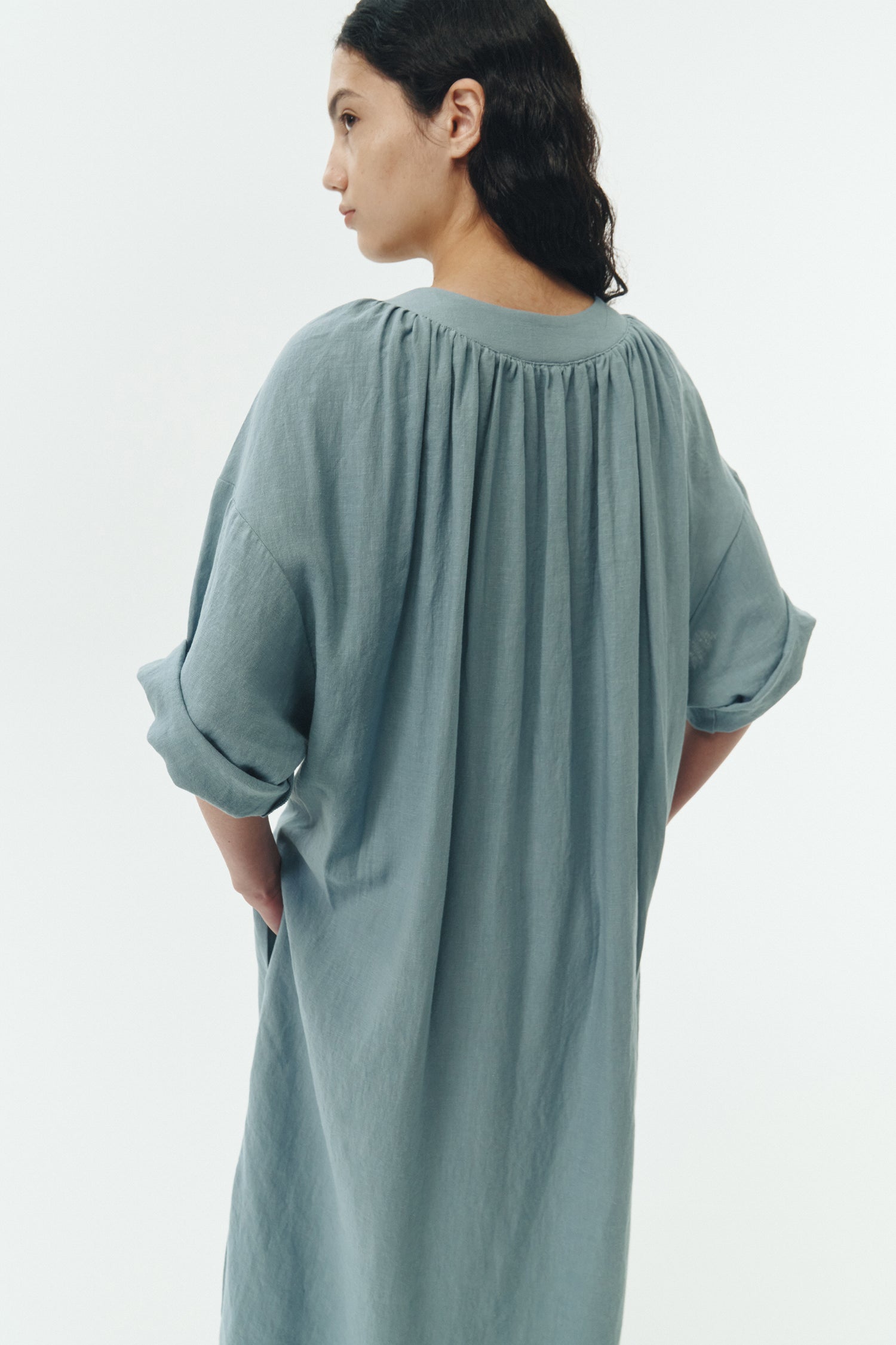 Charlotte Dress in light blue, V-neck summer maxi dress in a lightweight linen-rayon blend with drop shoulders, hidden side pockets, raw edge hem, and a relaxed fit.