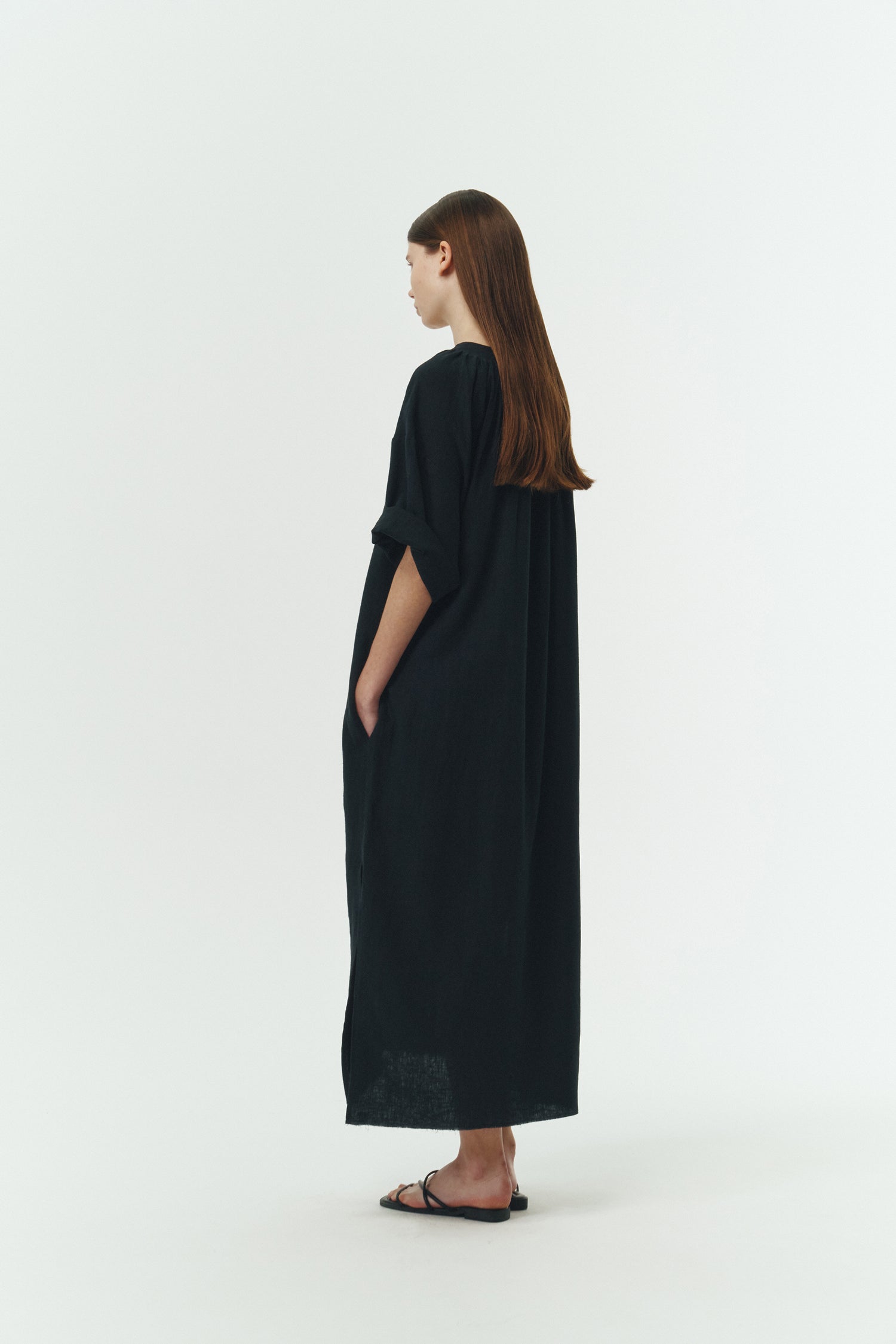 Charlotte Dress in navy, V-neck summer maxi dress in a lightweight linen-rayon blend with drop shoulders, hidden side pockets, raw edge hem, and a relaxed fit.