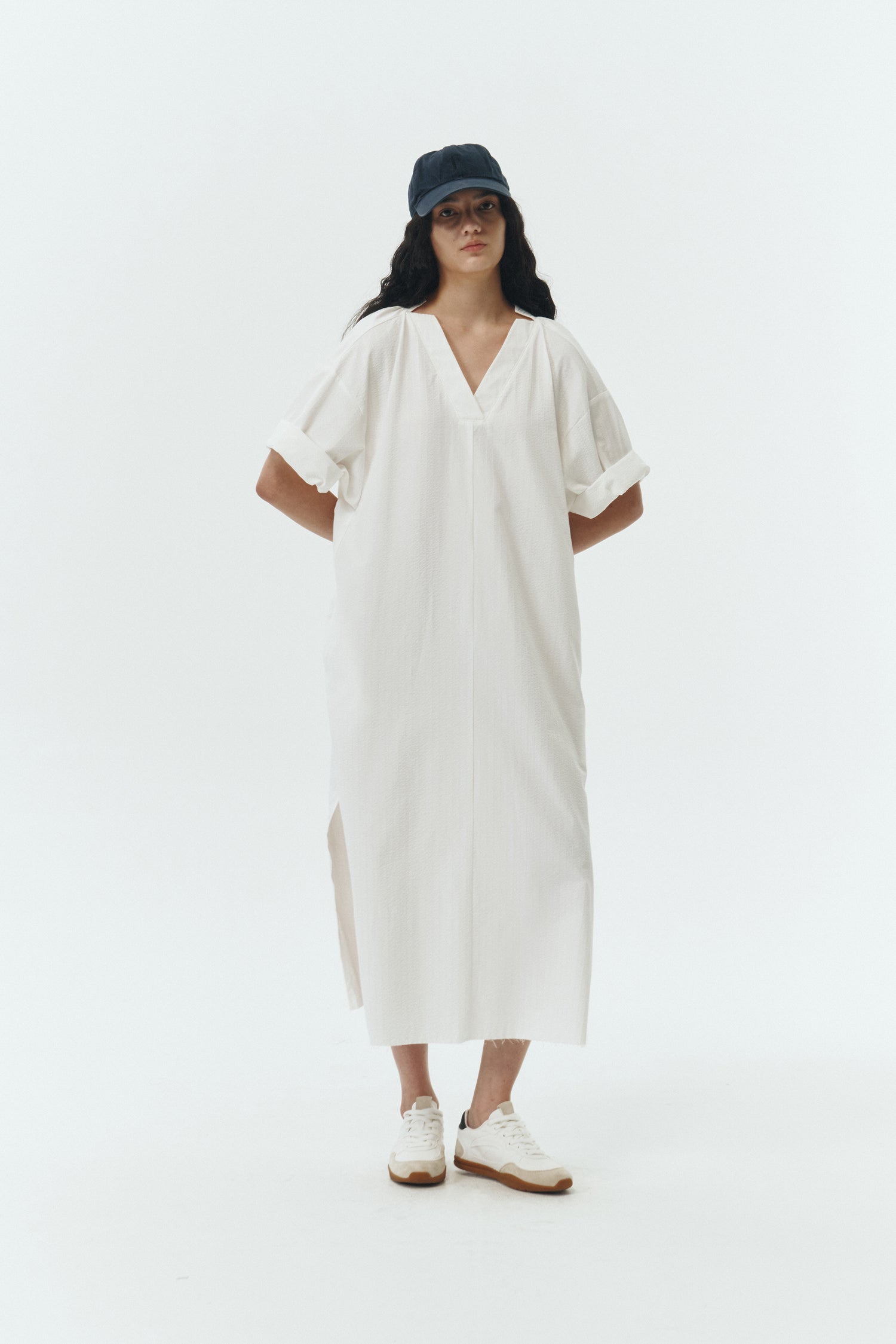 Charlotte Dress in white stripe, V-neck summer maxi dress in a lightweight linen-rayon blend with drop shoulders, hidden side pockets, raw edge hem, and a relaxed fit.