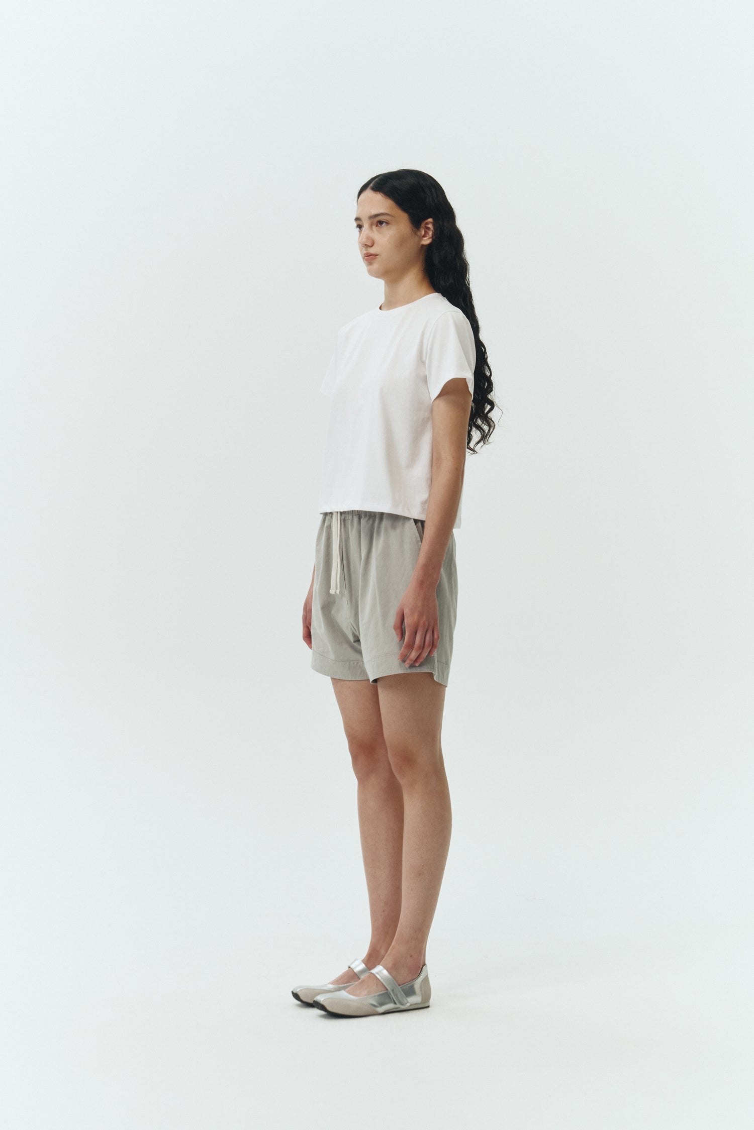 Ivy T-shirt in white, cropped short-sleeve tee in a lightweight cotton-poly blend with crew neck, regular fit, and clean silhouette.