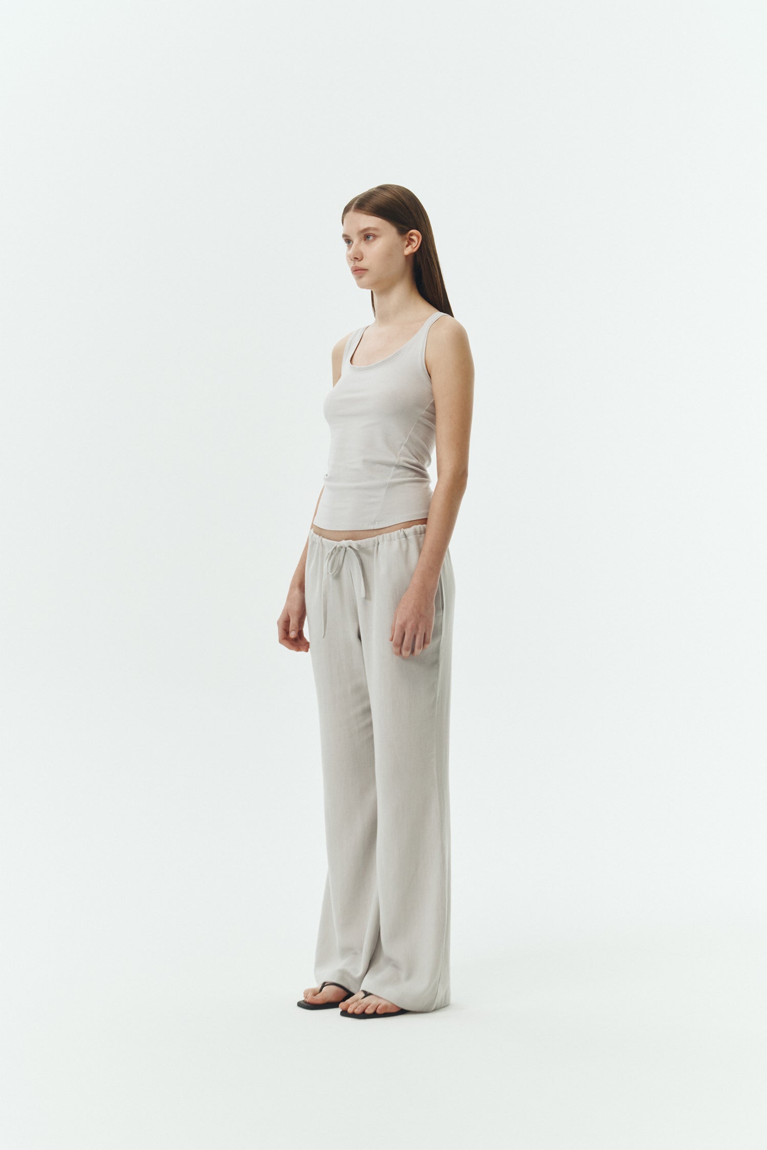 Zoe Tank Top in cloud gray, slim-fit stretch cotton tank with scooped neckline and diagonal seam detail for a sleek and minimal silhouette.