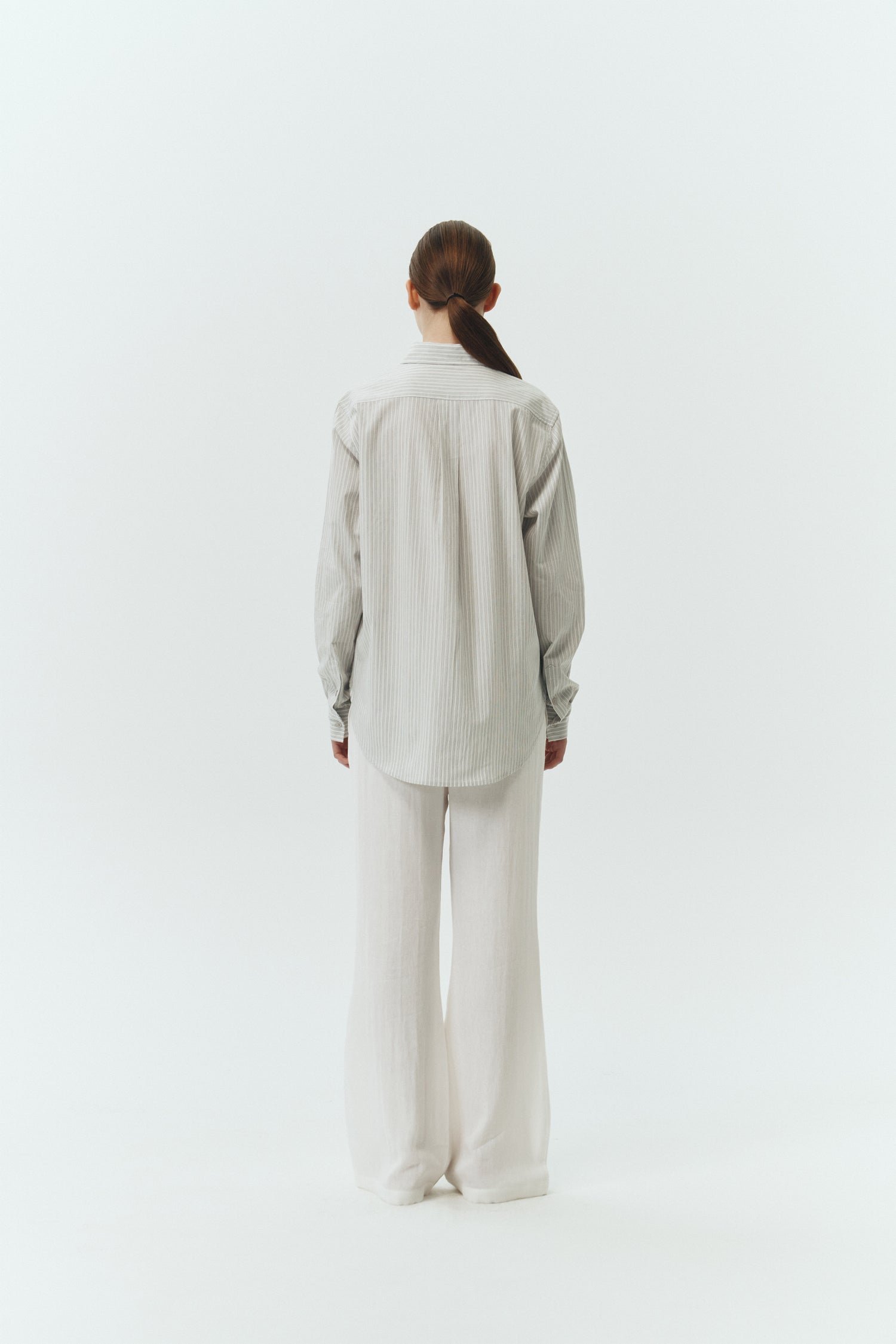 Isabella Shirt in stripe, a lightweight cotton-poly blend button-up with chest pocket, back pleat, and buttoned cuffs, designed in a regular fit with a hip-length silhouette