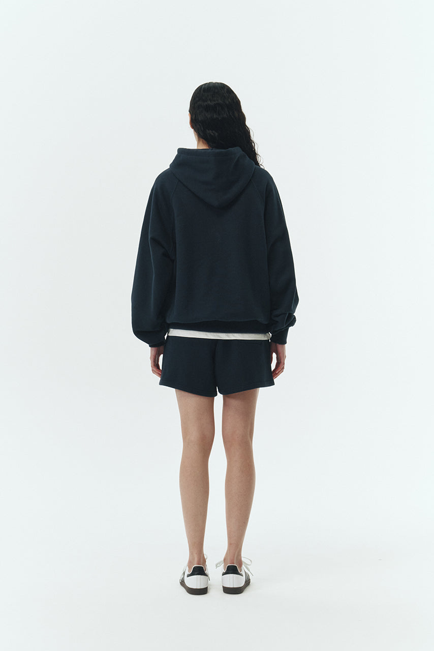 Kaia Shorts in navy, mini-length cotton French terry shorts with an elasticated drawstring waist, side pockets, and back pocket, regular fit, part of a casual set