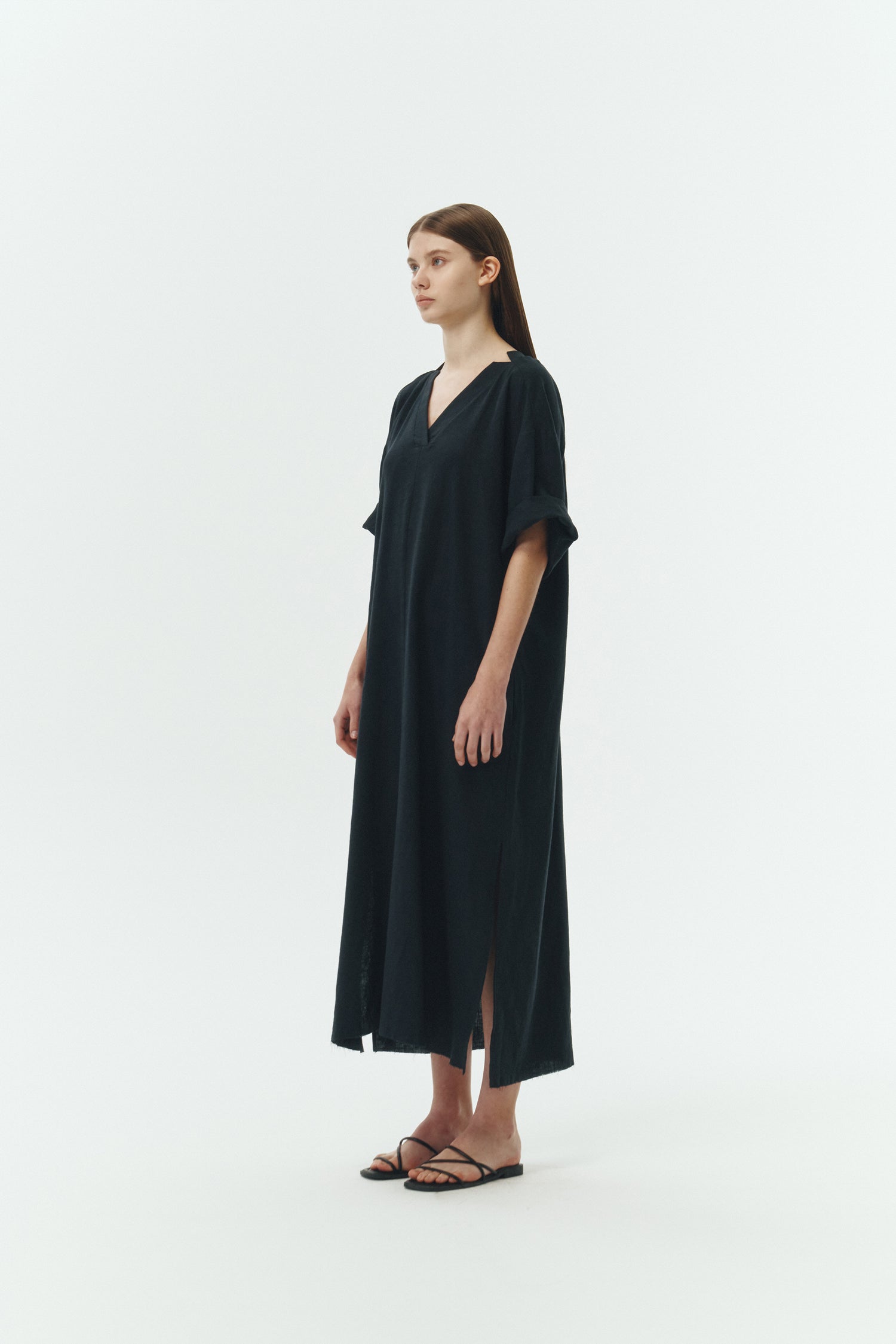 Charlotte Dress in navy, V-neck summer maxi dress in a lightweight linen-rayon blend with drop shoulders, hidden side pockets, raw edge hem, and a relaxed fit.