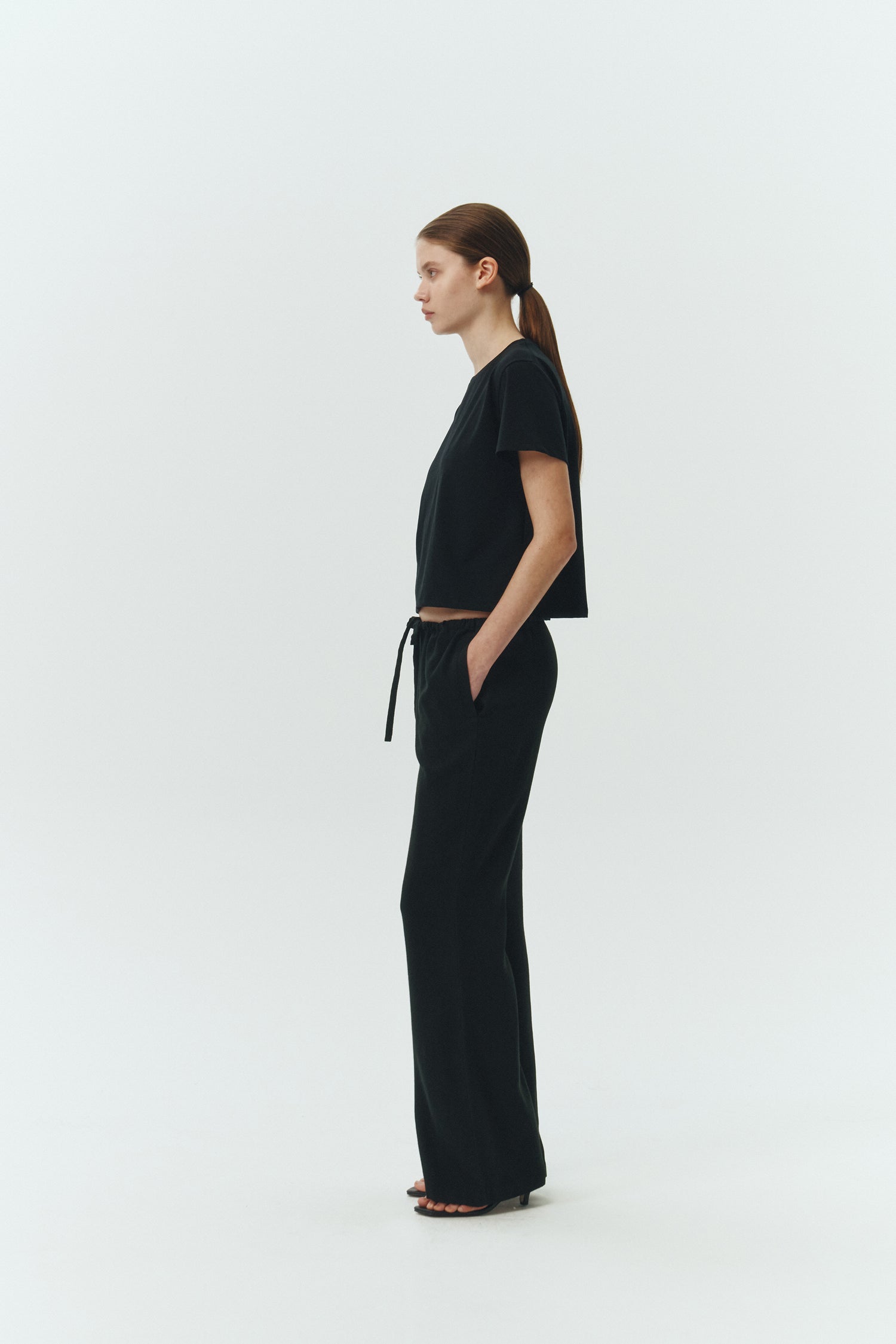 Ivy T-shirt in black, cropped short-sleeve tee in a lightweight cotton-poly blend with crew neck, regular fit, and clean silhouette.