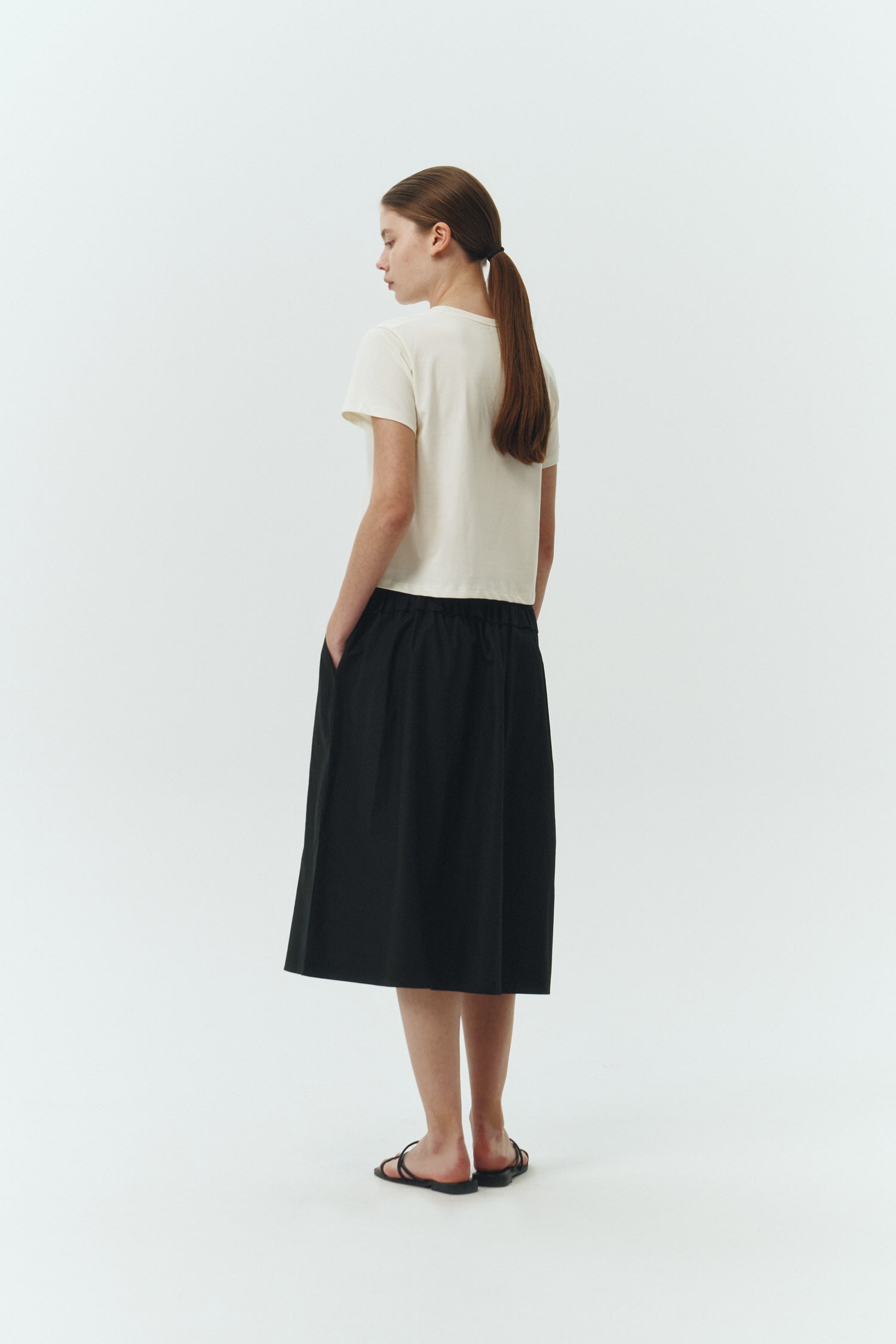 Ivy T-shirt in ivory, cropped short-sleeve tee in a lightweight cotton-poly blend with crew neck, regular fit, and clean silhouette.