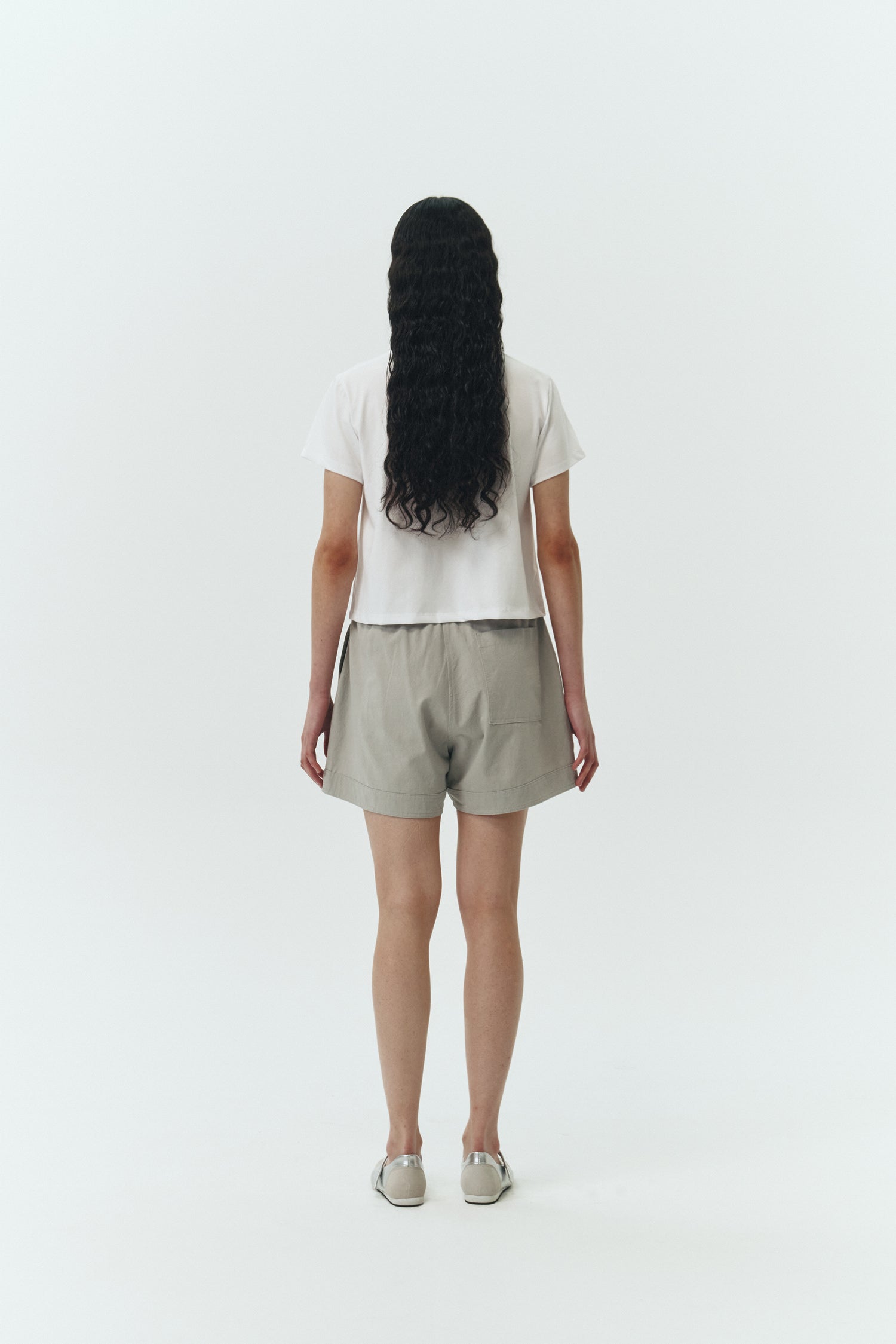 Ivy T-shirt in white, cropped short-sleeve tee in a lightweight cotton-poly blend with crew neck, regular fit, and clean silhouette.