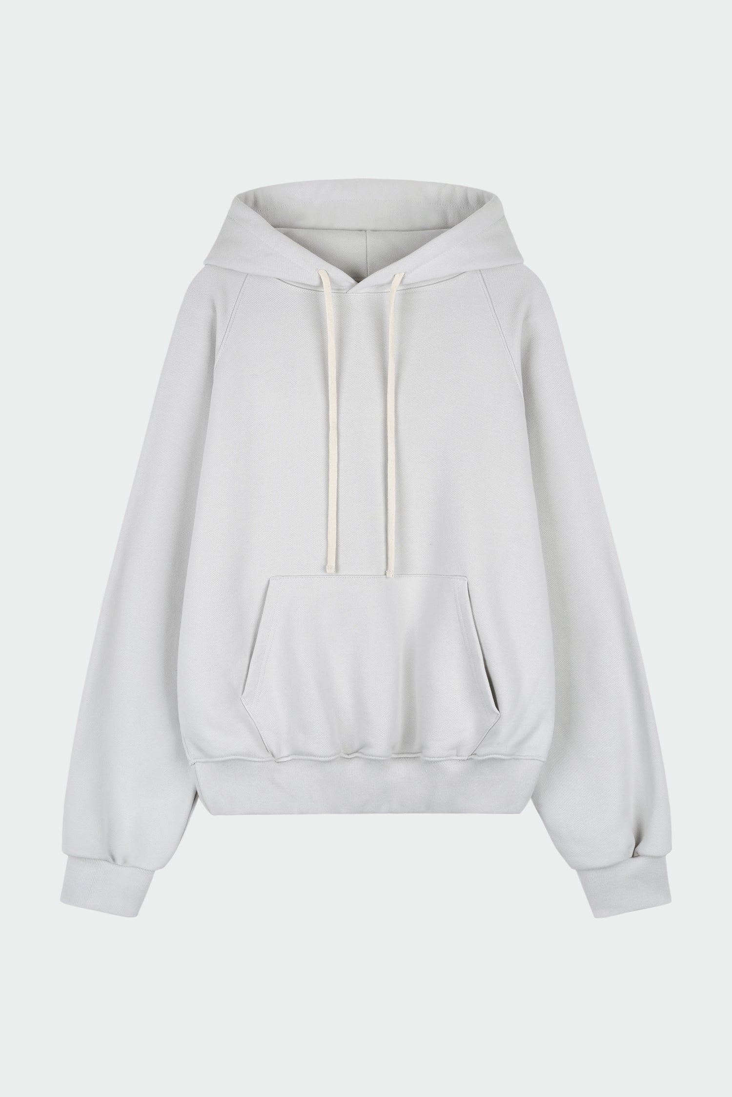 Kaia Hoodie in dune, oversized cotton French terry pullover with drawstring hood, raglan sleeves, kangaroo pocket, and ribbed trims.