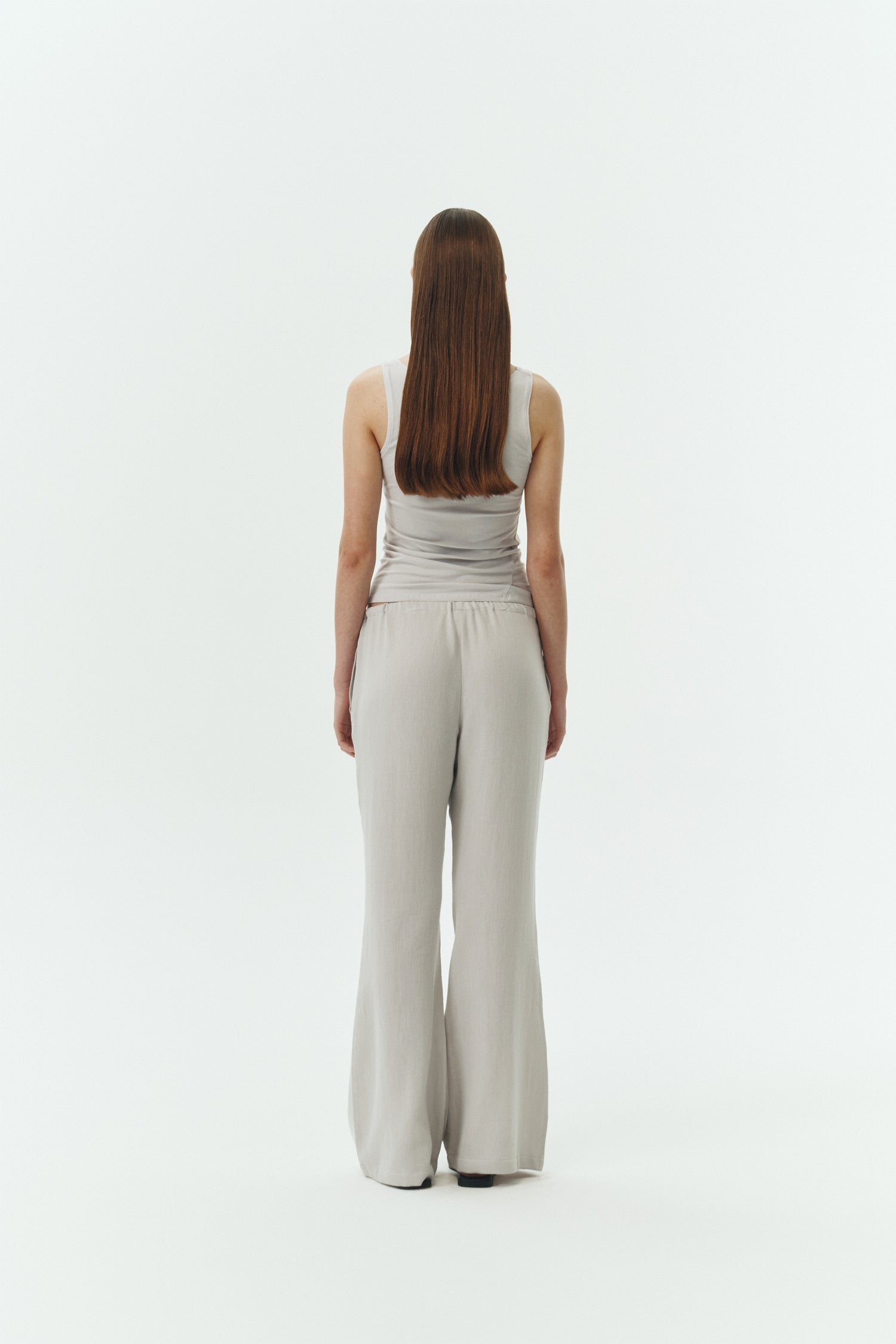 Zoe Tank Top in cloud gray, slim-fit stretch cotton tank with scooped neckline and diagonal seam detail for a sleek and minimal silhouette.