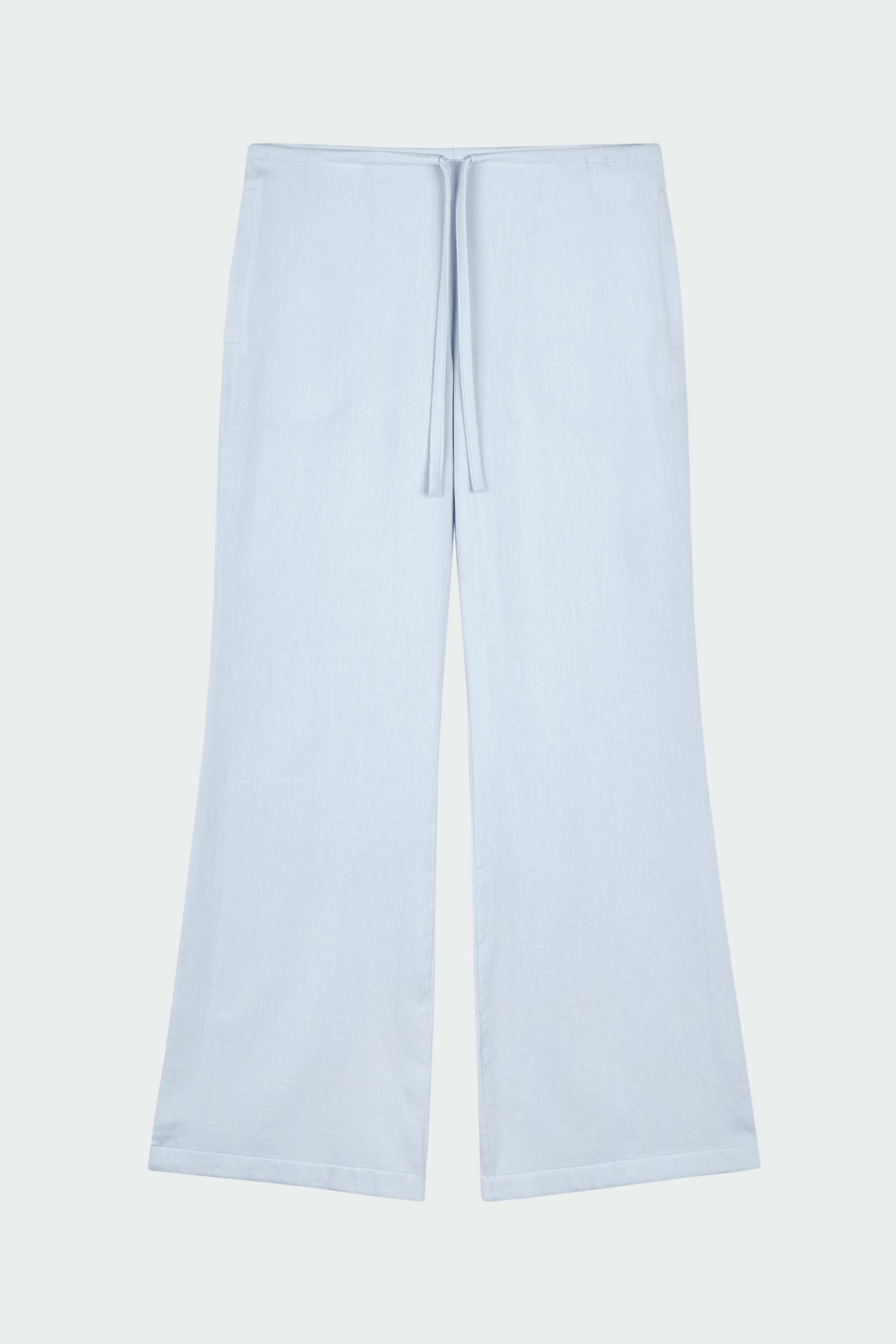 Chloe Pants in sky, lightweight cotton pants with a drawstring waist, side pockets, and a flared bottom, relaxed fit for effortless everyday wear